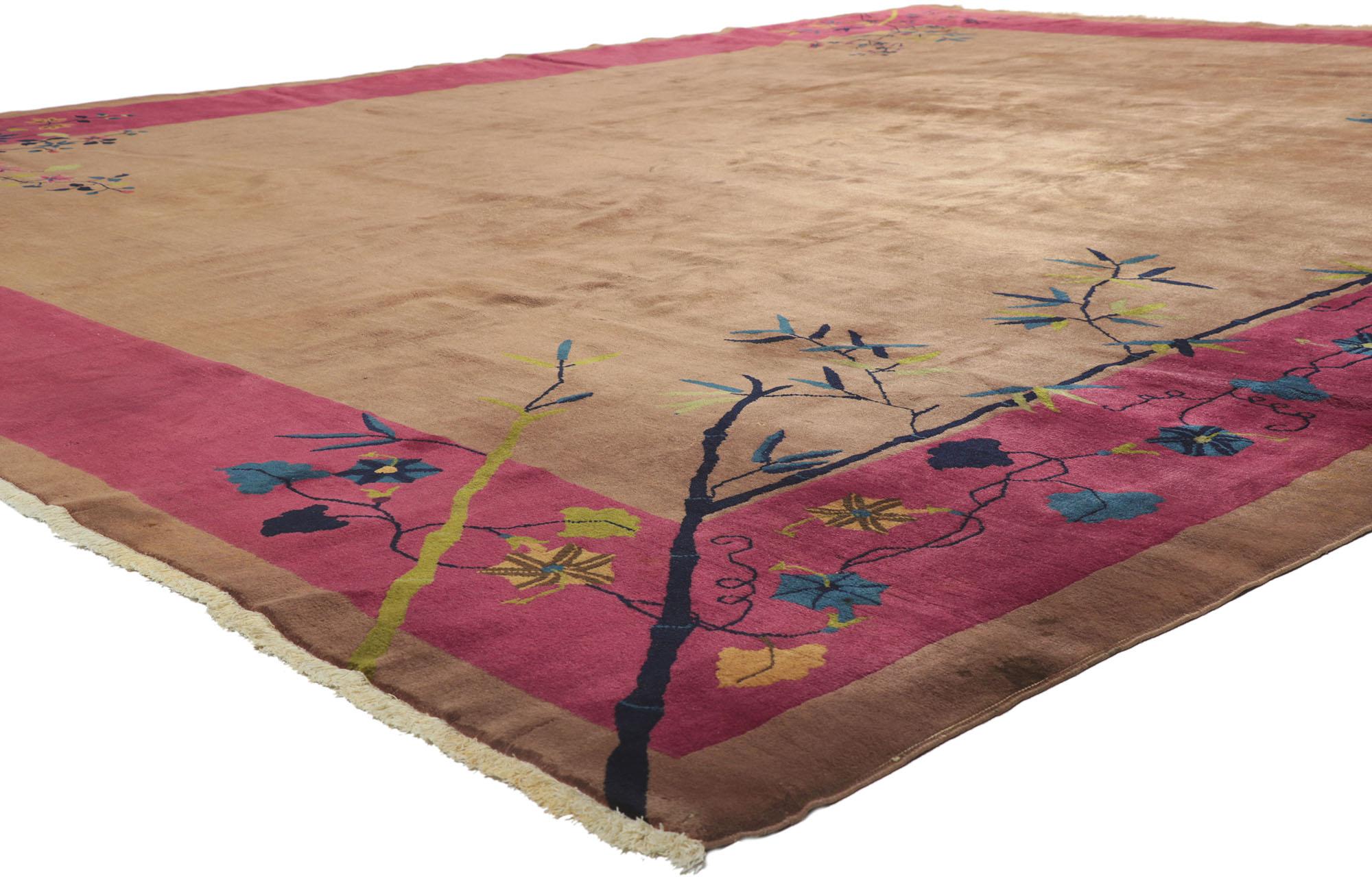 78243 Antique Chinese Art Deco Rug, 11'10 X 14'00. This hand knotted wool antique Chinese Art Deco rug features a color-blocked field and border scheme festooned with glorious sprays of flowers. Lotuses, peonies, chrysanthemums, and plum blossoms