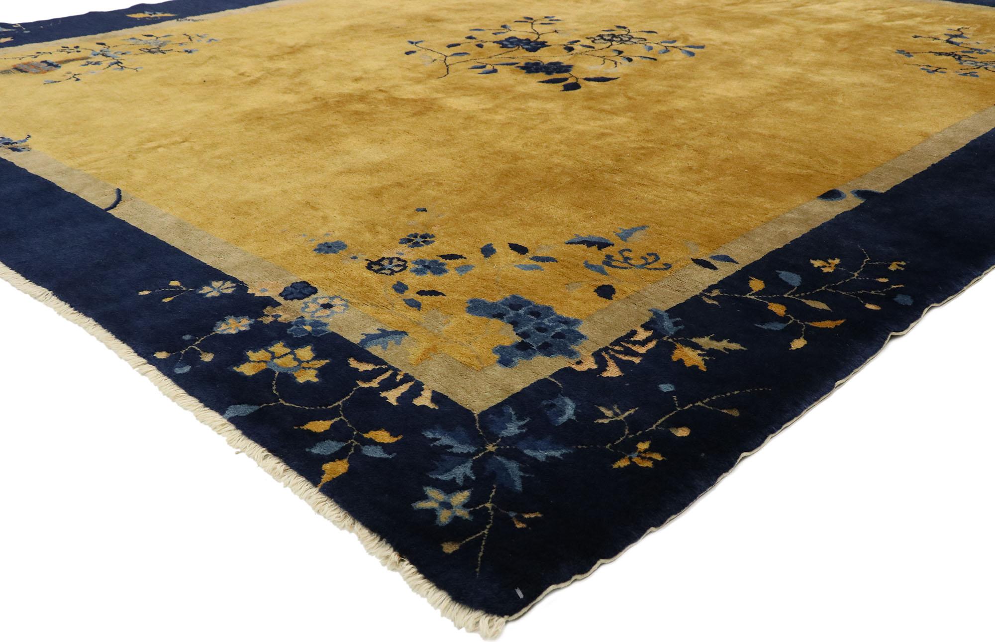 77453, antique Chinese Art Deco rug with chinoiserie style? This hand knotted wool antique Chinese Art Deco rug features a color-blocked field and border scheme festooned with delicate sprays of flowers. In the center, an intricate floral bouquet is