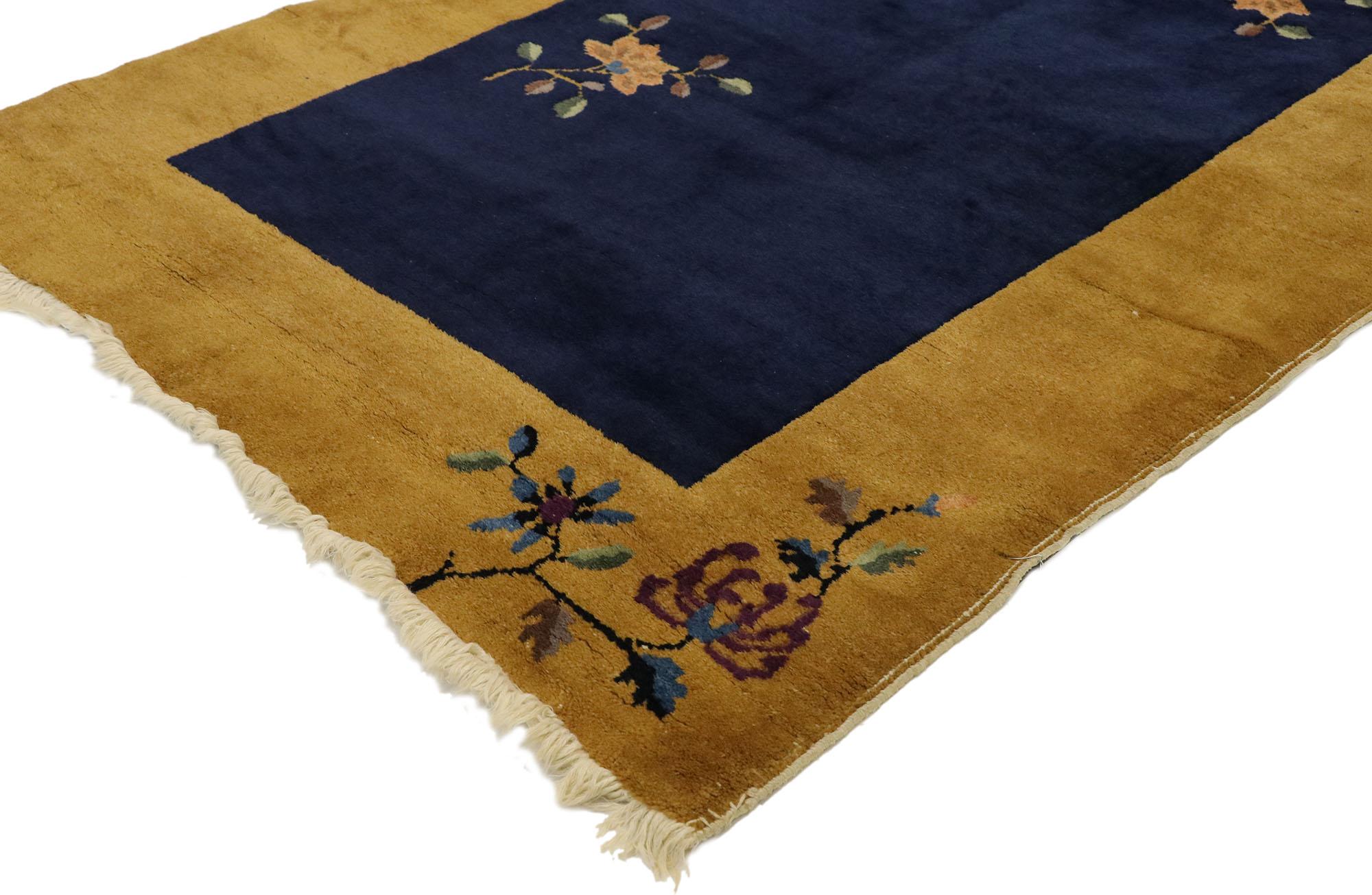 77447 antique Chinese Art Deco rug with Minimalist Qing Dynasty style. This hand knotted wool antique Chinese Art Deco rug features a color-blocked field and border scheme festooned with a Minimalist Qing Dynasty style. The open abrashed midnight