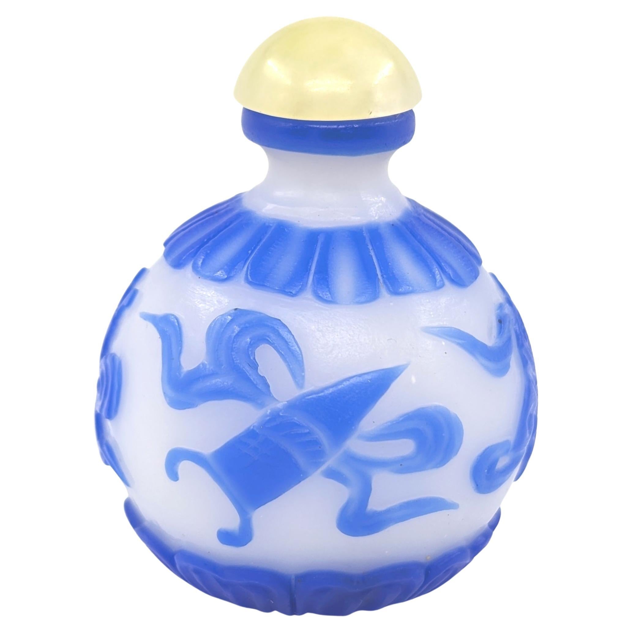 Chinese Blue Glass Overlay Globular Snuff Bottle Carved Buddhist Treasures 20c In Good Condition For Sale In Richmond, CA