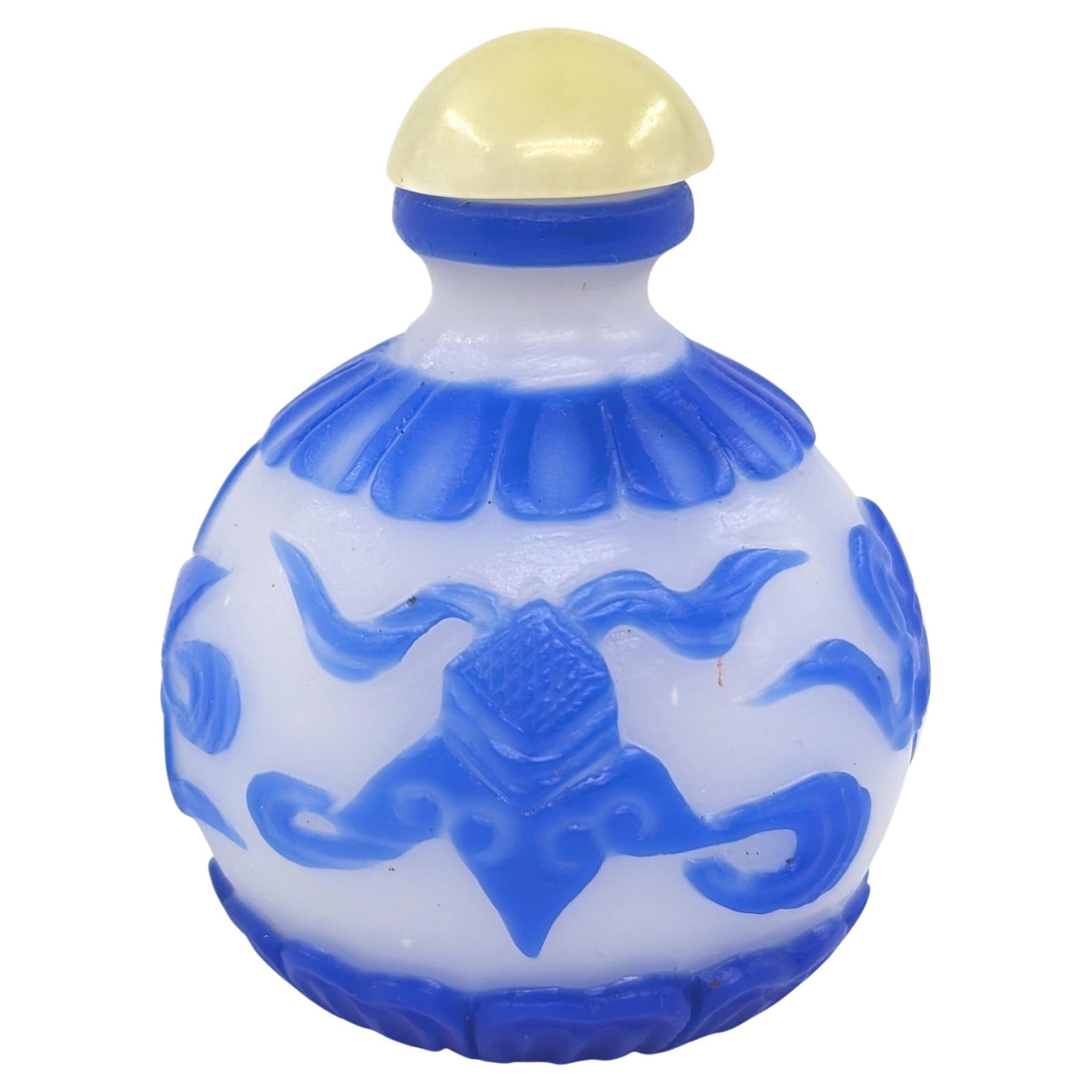 Hand-Carved Chinese Blue Glass Overlay Globular Snuff Bottle Carved Buddhist Treasures 20c For Sale