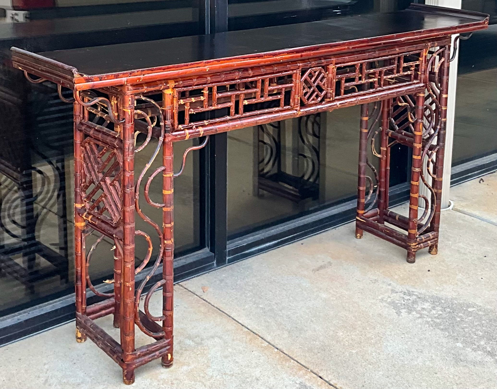 This is a 19th century Chinese bamboo altar table with ebonized wood top. It has elaborate scrolled fretwork. This piece has age appropriate wear.

My shipping is for the Continental US only and can run 2 to 5 weeks. Please let me know if you need