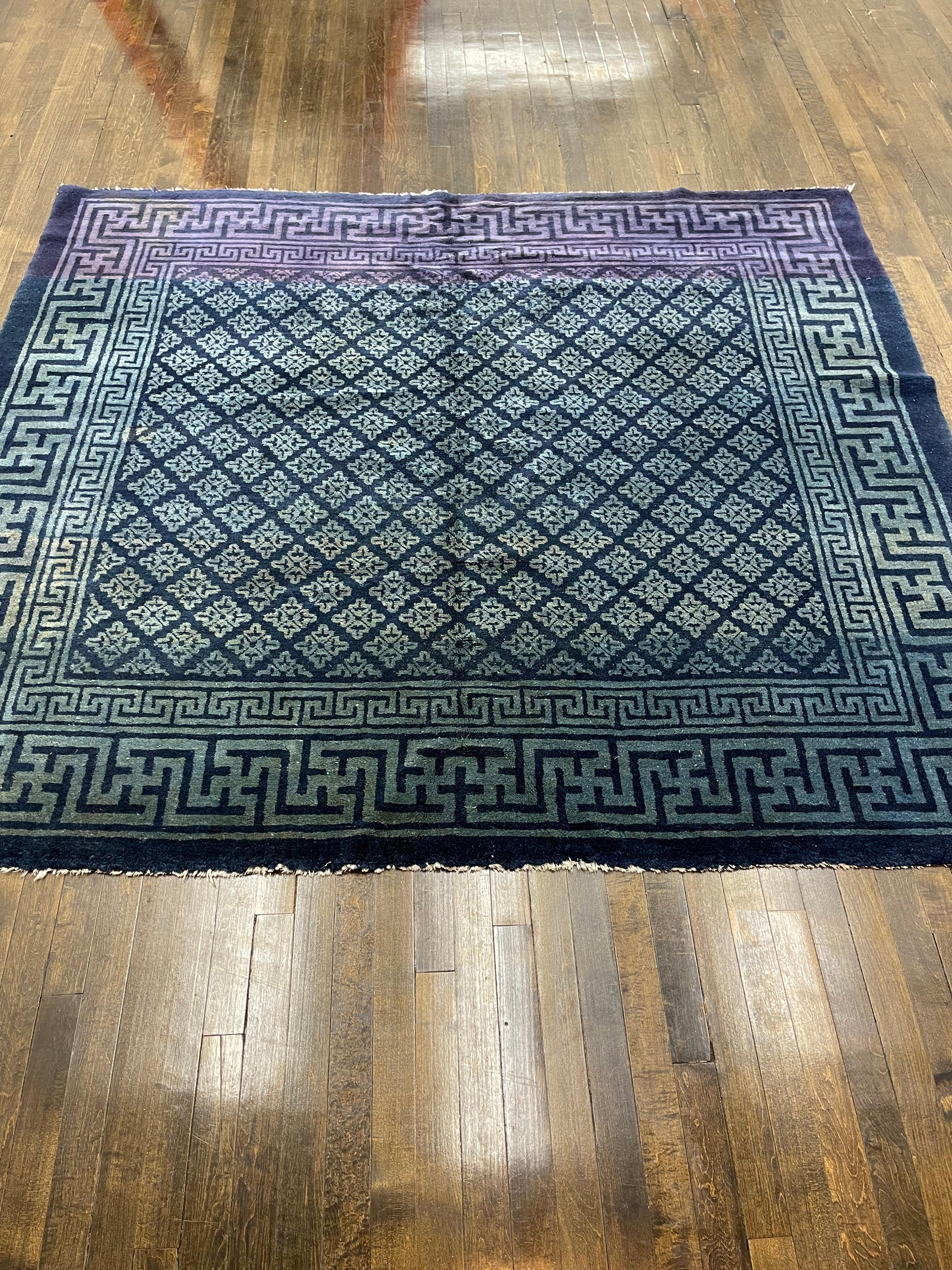 This rug was hand woven in China. A cery rare carpet known as Baotou, they come mostly in deep blue color with Abrash (natural discolorations that happen over time) and close to square in size. The 