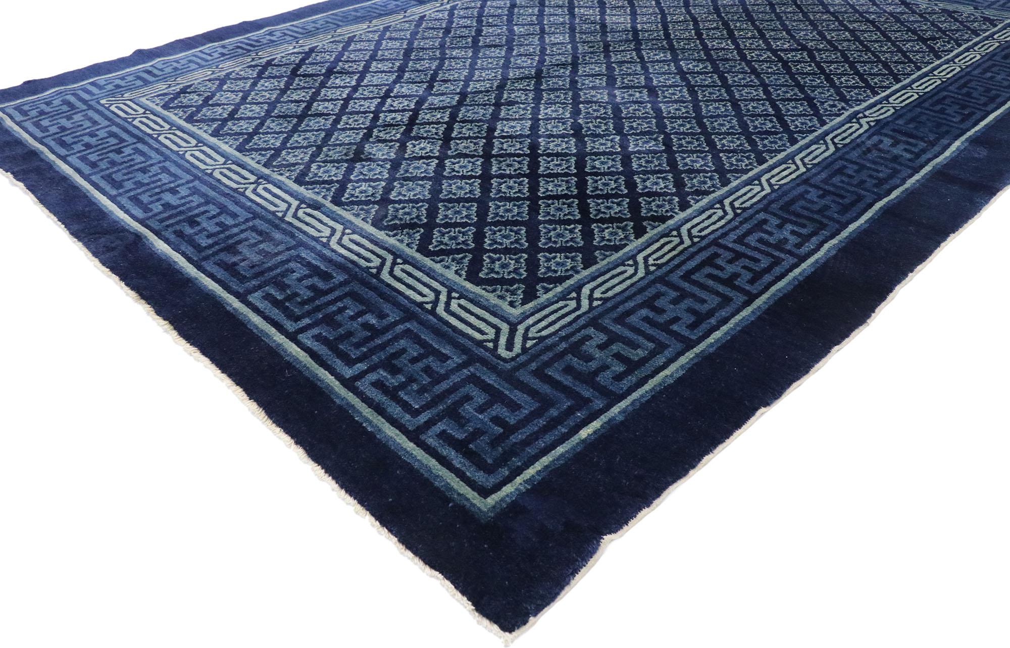 53395 antique Chinese Baotou rug with Qing Dynasty style. This hand-knotted wool antique Chinese Baotou rug features an all-over geometric pattern overlaid upon a sumptuous deep blue backdrop. Located in the Inner Mongolia region of northern China,