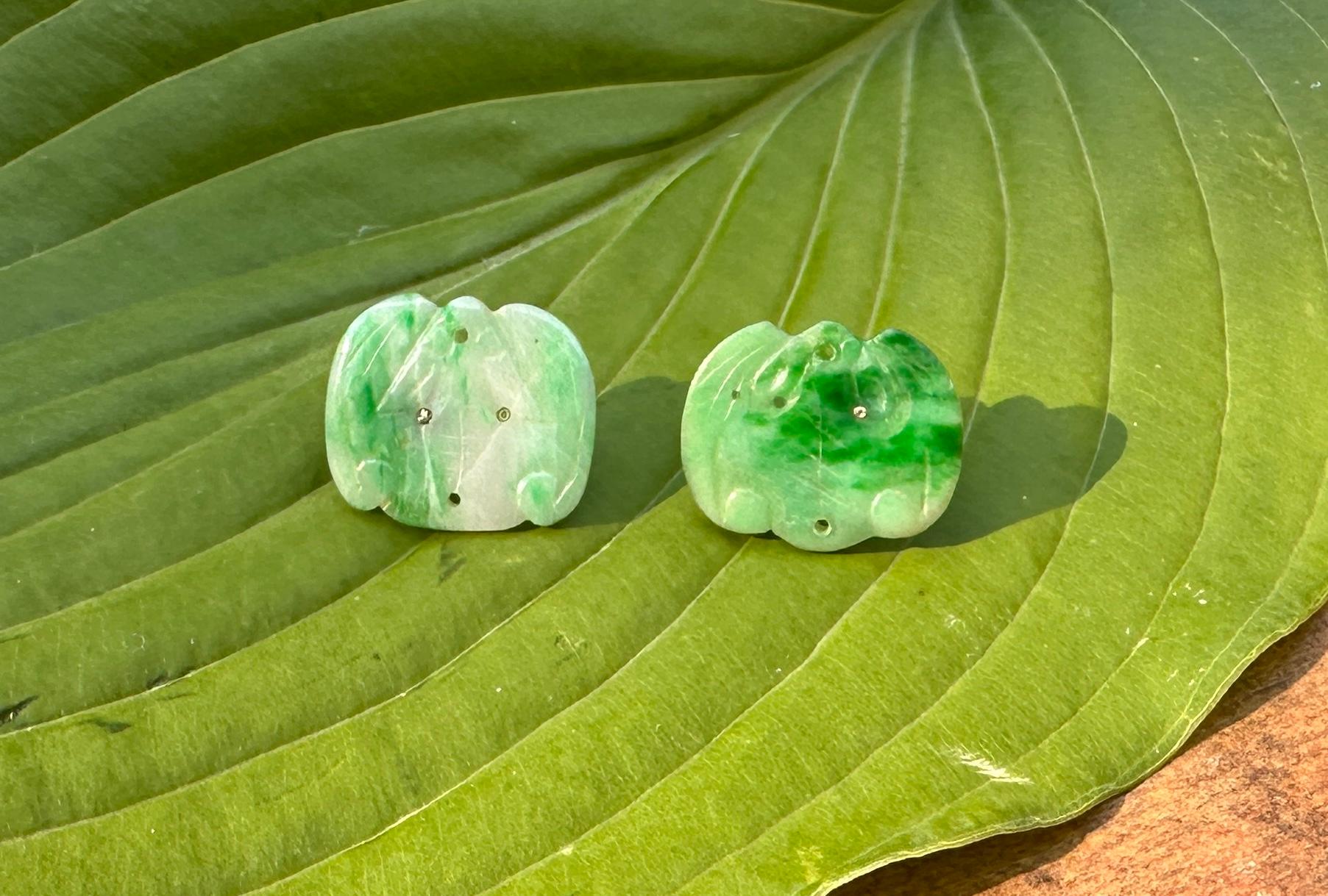 This is a delightful pair of antique Chinese Jade Earrings in the form of Bats.  The very rare Jade earrings are each hand carved in the form of a winged Bat. 
They are absolutely fabulous.   In Chinese Mythology Bats are seen as benevolent because