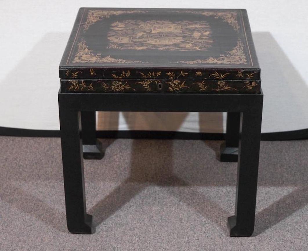 Antique Chinese black lacquer game box on later stand.