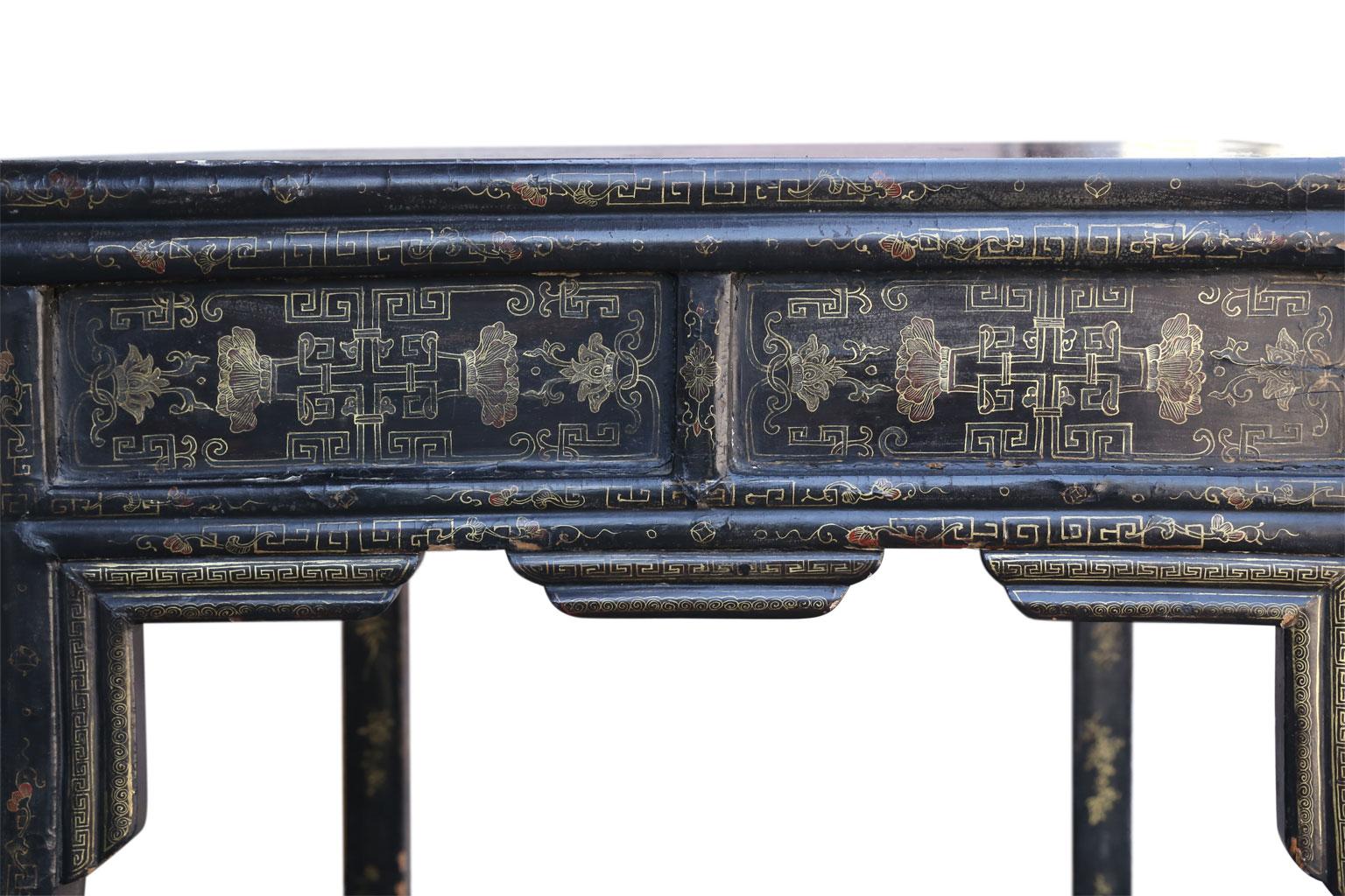 Antique Chinese black lacquer table (circa 1880-1920) constructed using mortise and Tenon joints as well as nails. Signs of vintage restoration under top. Designed to emulate the form of a bamboo table. Adorned with gilt and painted decoration (see