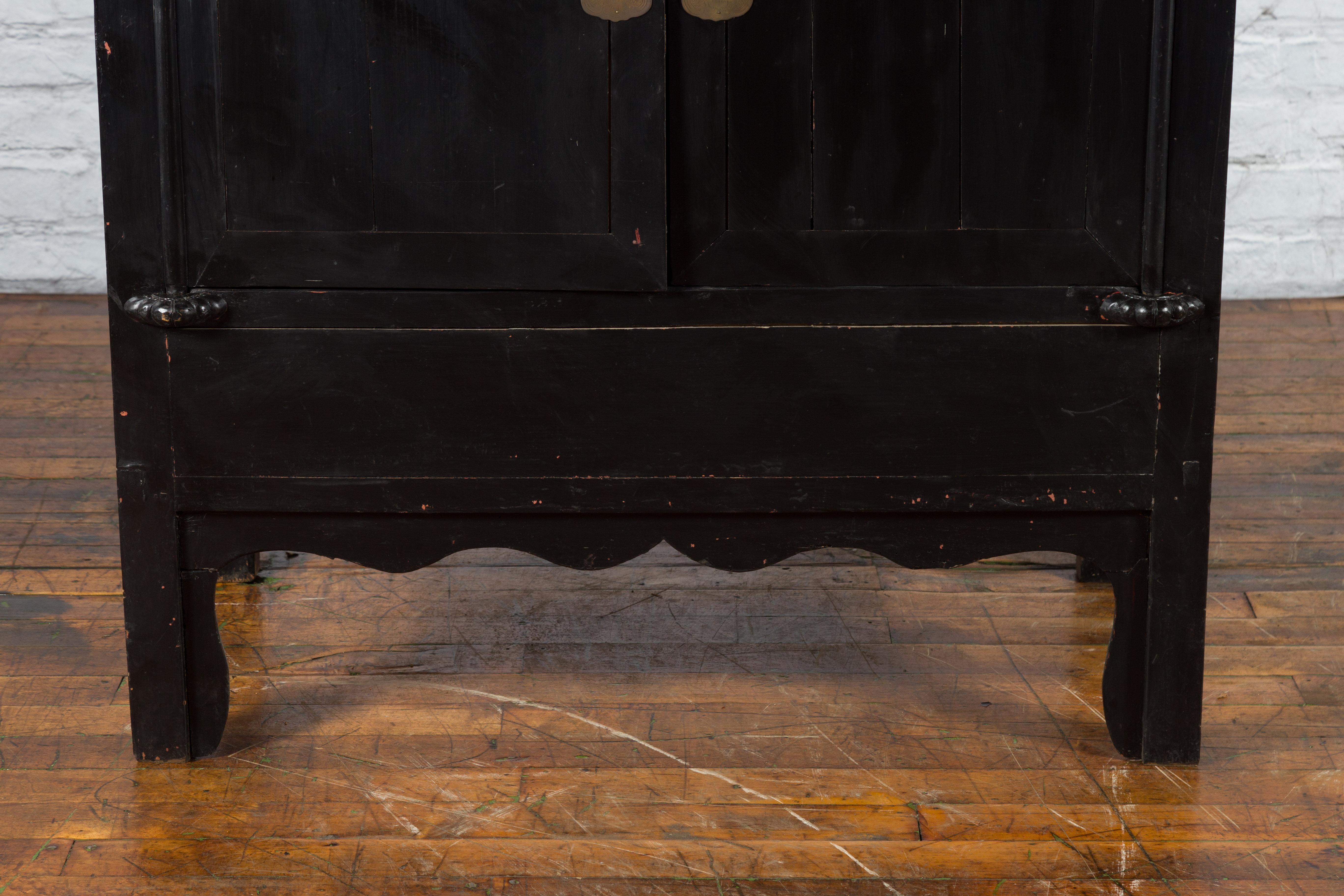 Wood Antique Chinese Black Lacquer Wedding Cabinet with Oversized Brass Medallion For Sale