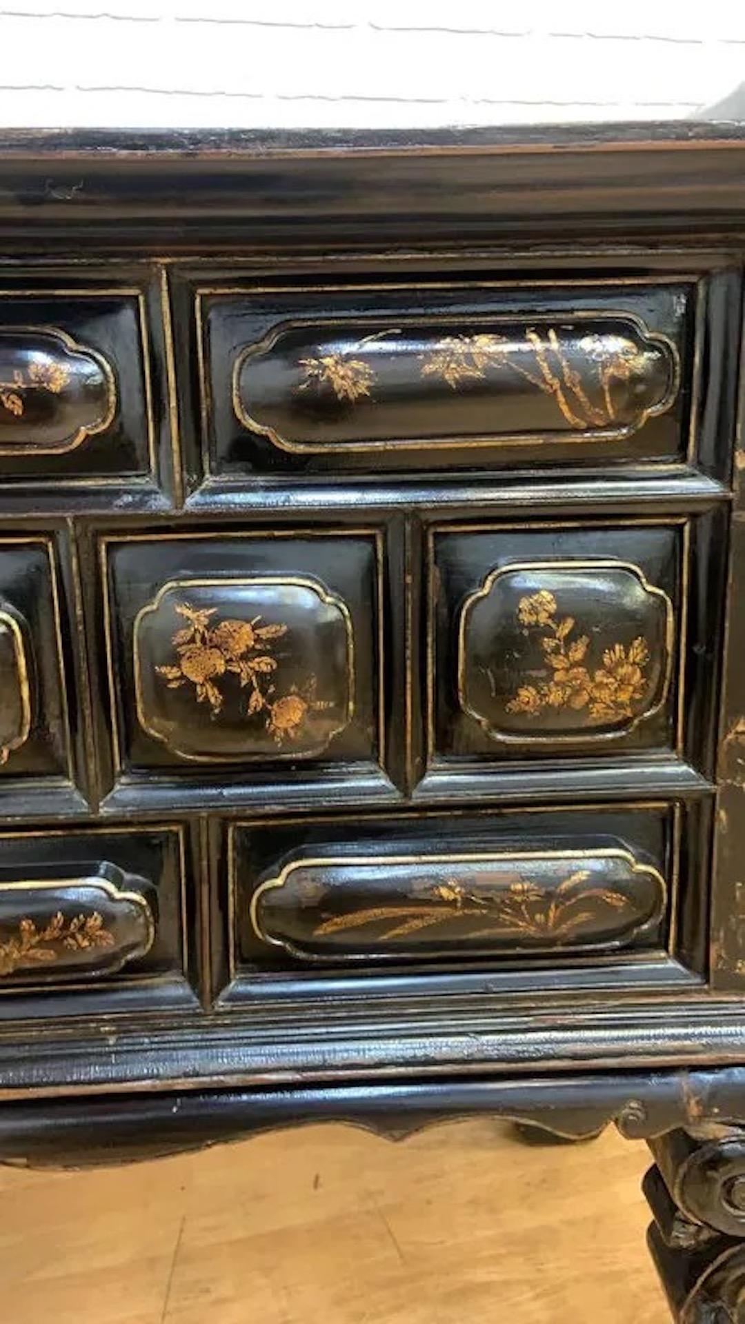 Antique Chinese Black & Red Lacquered Chinoiserie Altar Storage Chest

Decorate your space with this 19th century Chinese elmwood altar storage chest. Its 10 drawers make it perfect for all your storage needs. Each drawer is hand painted with