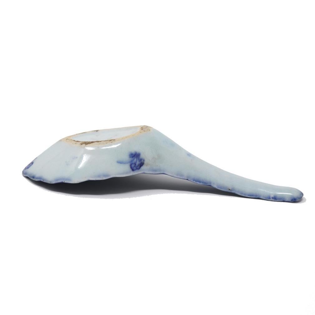 Antique Chinese Blue and White Porcelain Spoon. 
A deftly modeled fine porcelain spoon with unusual scalloped edge and crisp detailed under glaze cobalt blue painting having a surround perspective of a small boat on a lake with an anchored design of