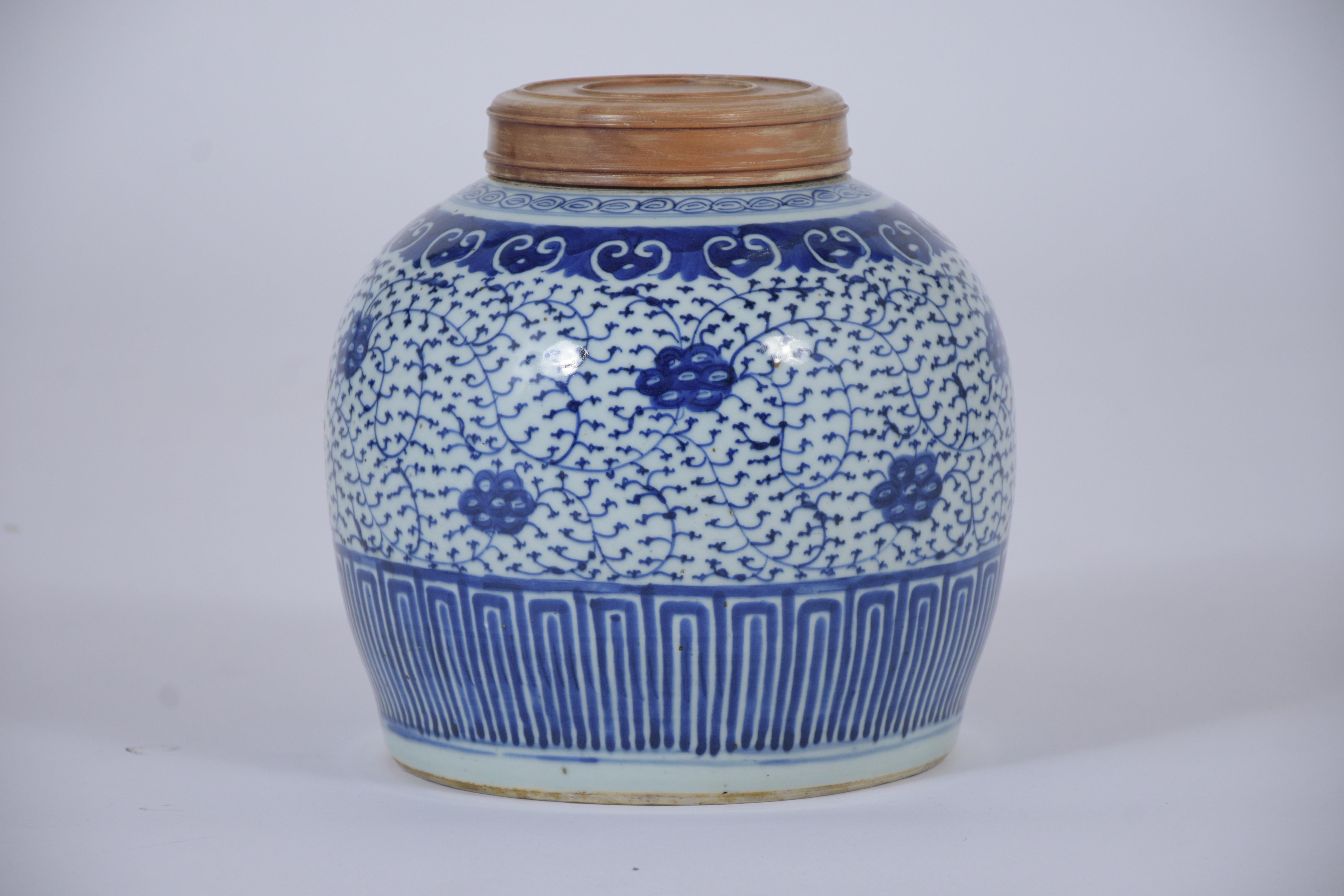 A unique Late 19th Century Chinese vase handcrafted of ceramic, this antique Jar features beautiful white and blue enameled finish detail a hand painted leaves and garland patterns design, this vase is sturdy, stunning, and ready to decorate any