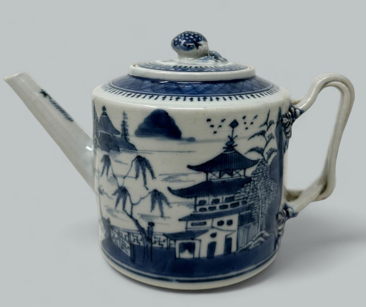 Superb and quire rare Chinese Blue and White Pagoda Pattern Lidded Porcelain Tea Pot of traditional form and of good size proportions, last quarter of the Eighteenth Century. Qing Dynasty. 
Of drum form with entwined handle. Superbly painted in