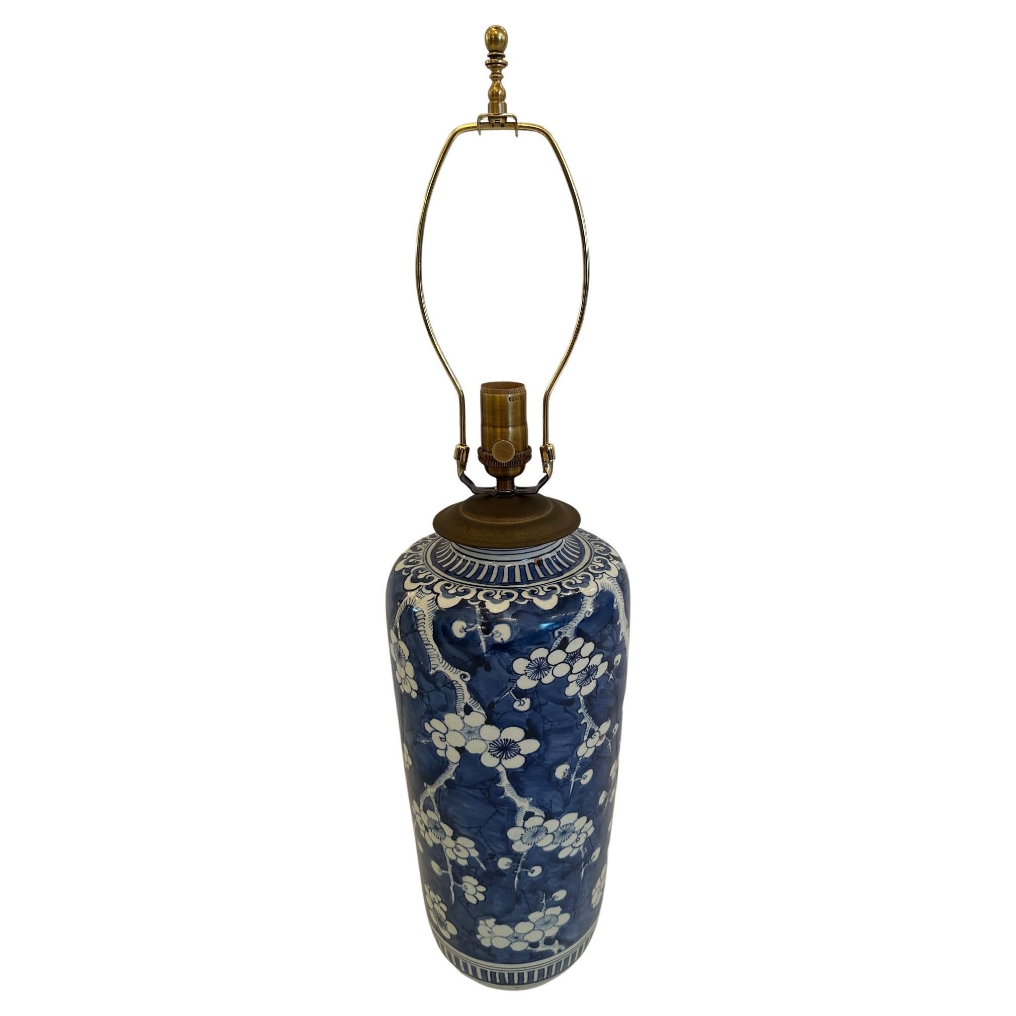 Classically elegant timeless vintage Chinese blue and white table lamp having lovely floral decoration. Custom shade is 10