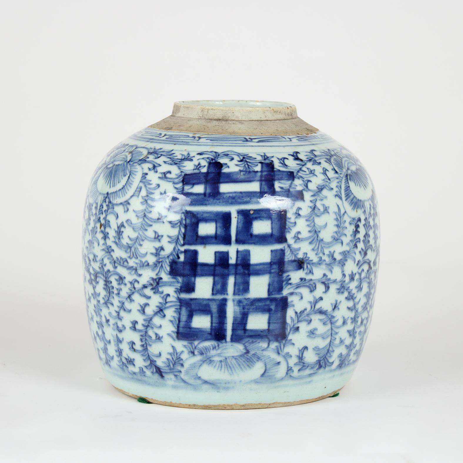 This 1930s Chinese Vase is made of ceramic with a white and blue finish. Adorning the vase are floral patterns and Chinese characters. This vase is sturdy, stunning, and ready to decorate any room for years to come.