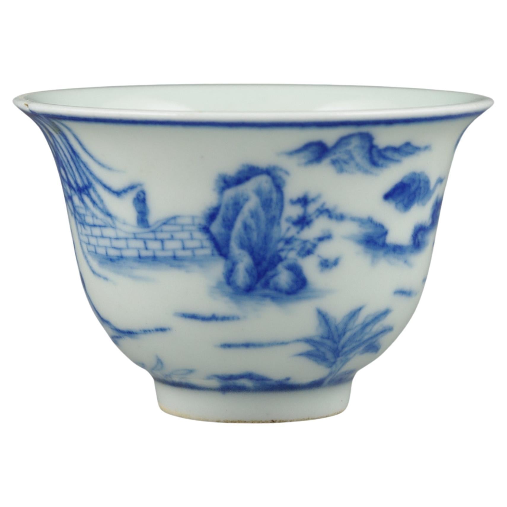 A fine Chinese porcelain wine cup, hand painted in underglaze blue with figures in various martial arts pursuits, with a four character Daoguang mark within the footring, and of the period

circa 1850, Qing Dynasty