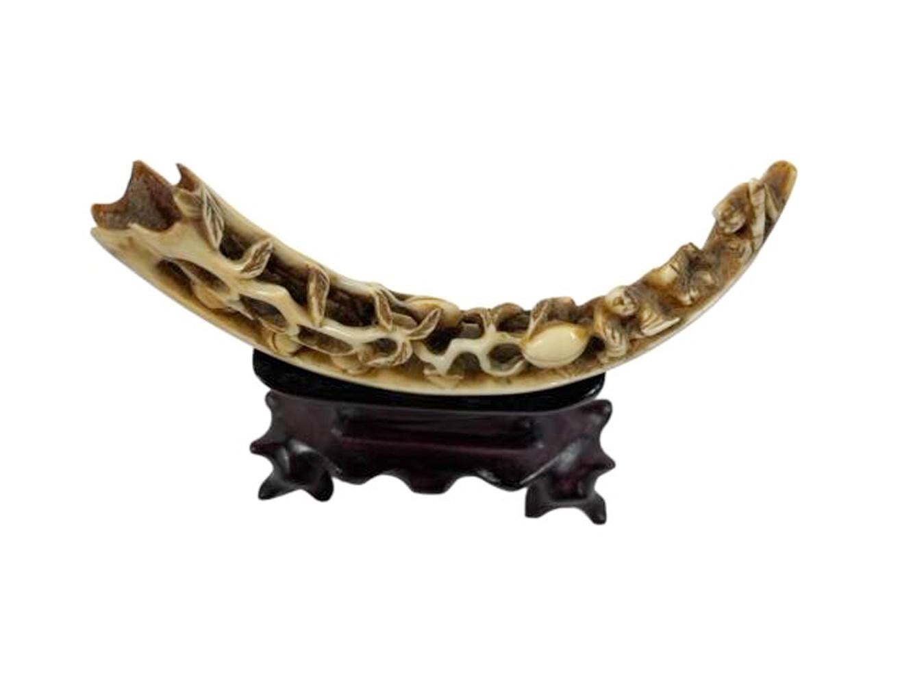 19th Century Antique Chinese Boar's Tusk with Carved Peaches on a Carved Hardwood Stand For Sale