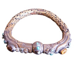 Antique Chinese Brass Bracelet with Turquoise and Tiger Eye Bezel Set Stones.