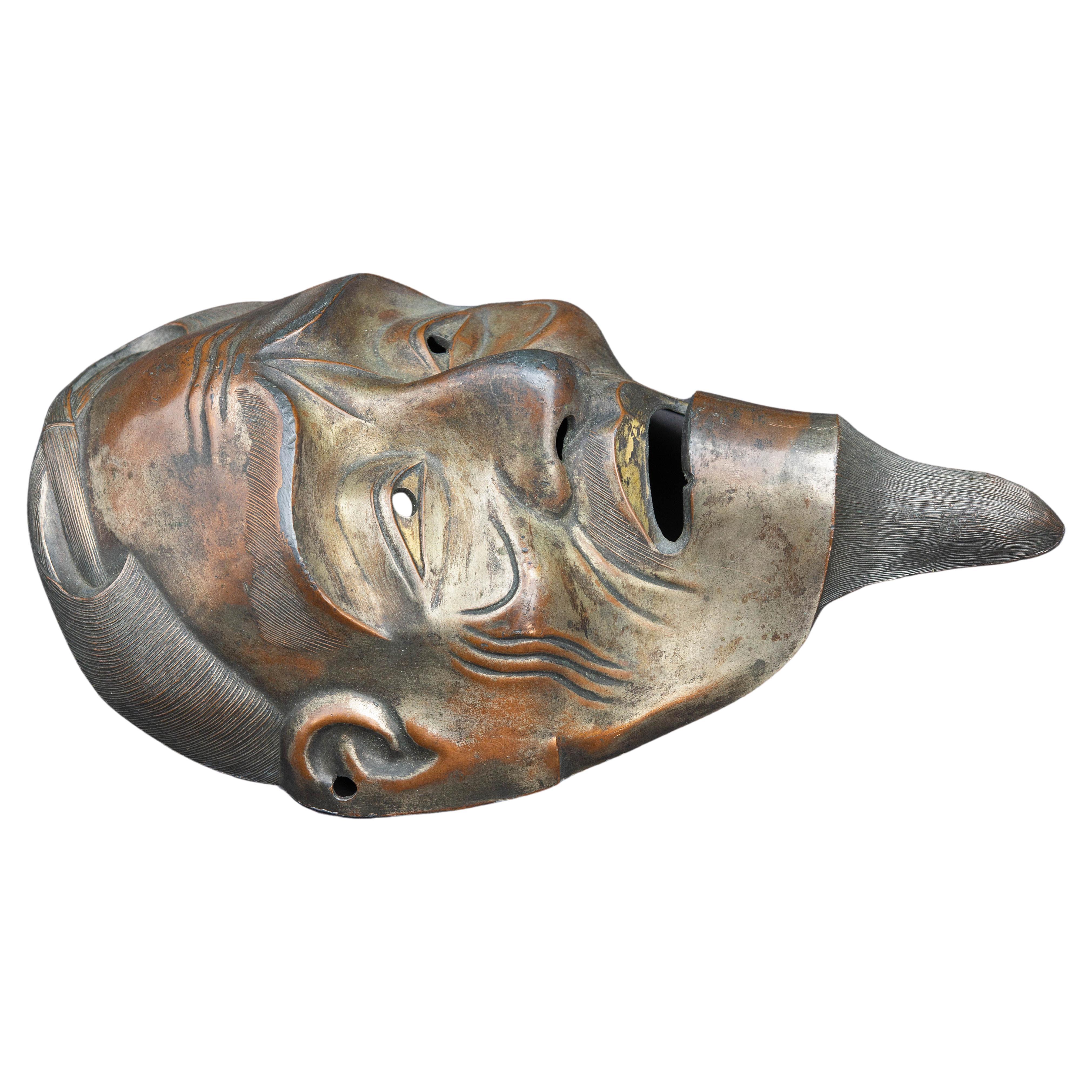 Antike chinesische Bronzemaske.