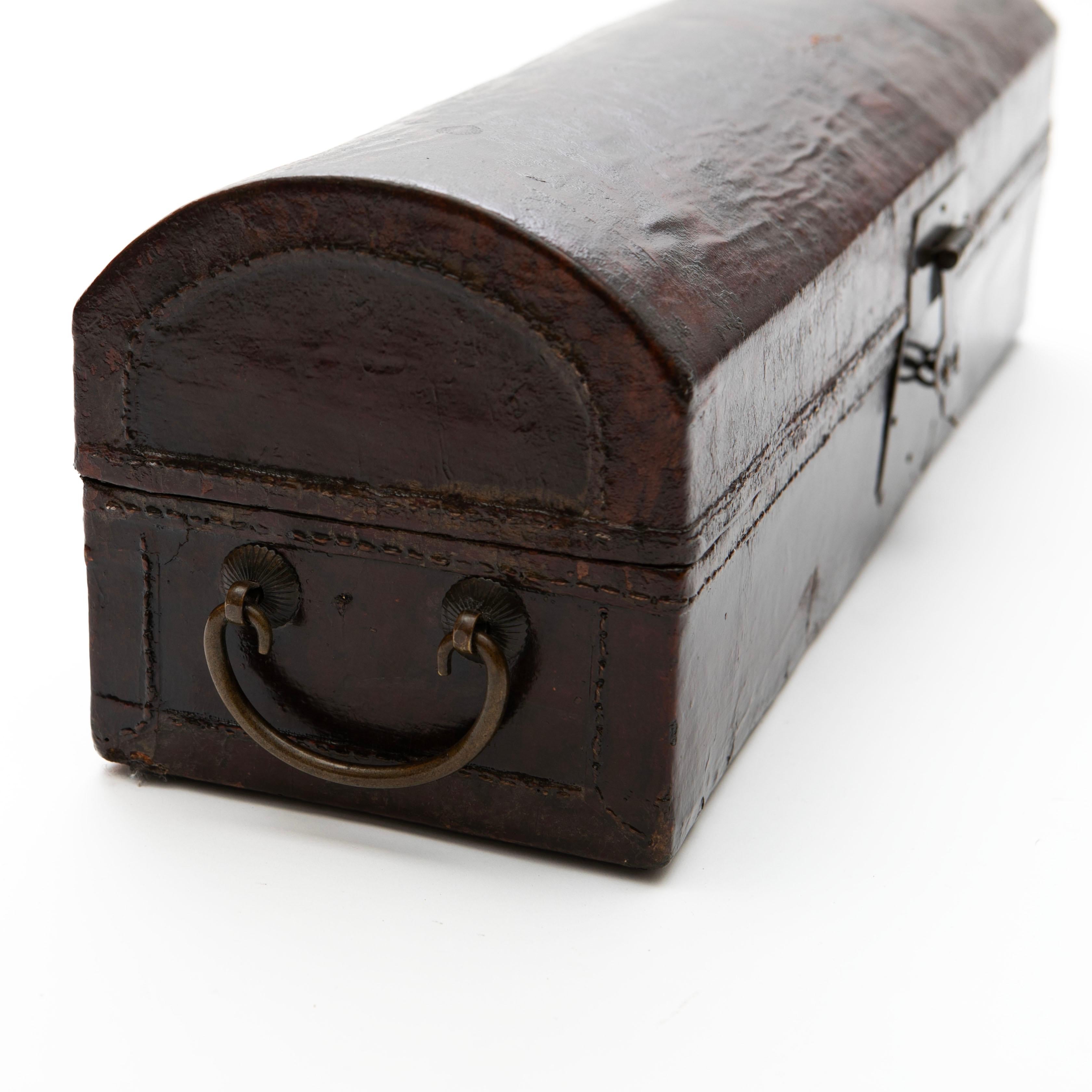 Lacquered Antique Chinese Burgundy Lacquer Pillow Chest with Leather and Metal Details