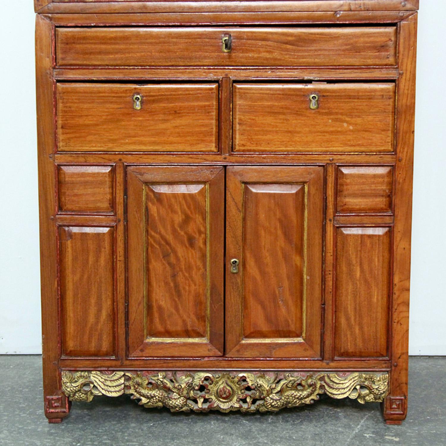 Antique Chinese cabinet with gilt decoration, hand carved.