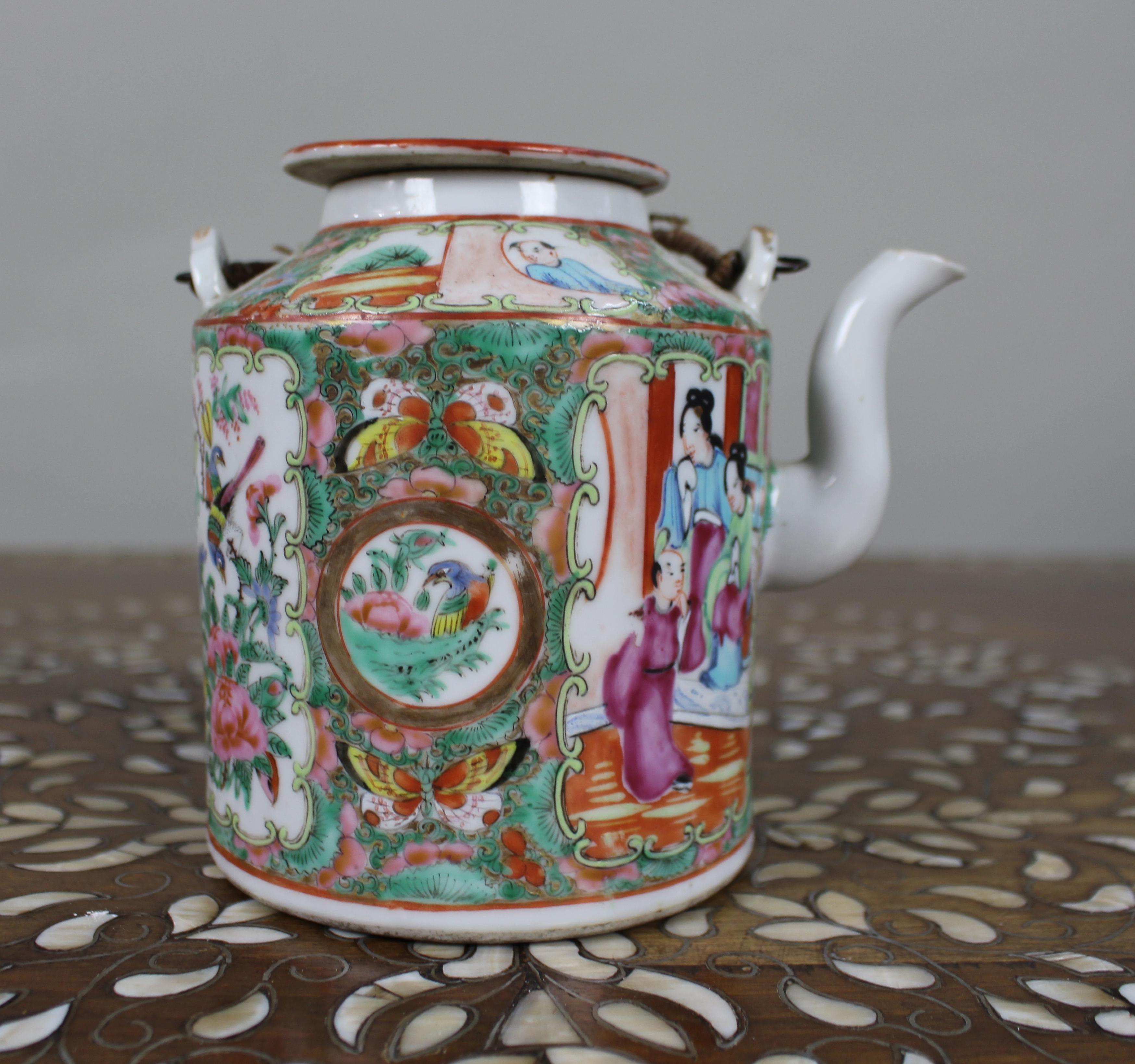 Antique Chinese Canton Famille Rose Porcelain Tea Pot c.1880

A fine antique Chinese porcelain tea pot, dating from around 1880, beautifully hand-painted in the Canton famille rose palette. The decoration features alternating panels depicting