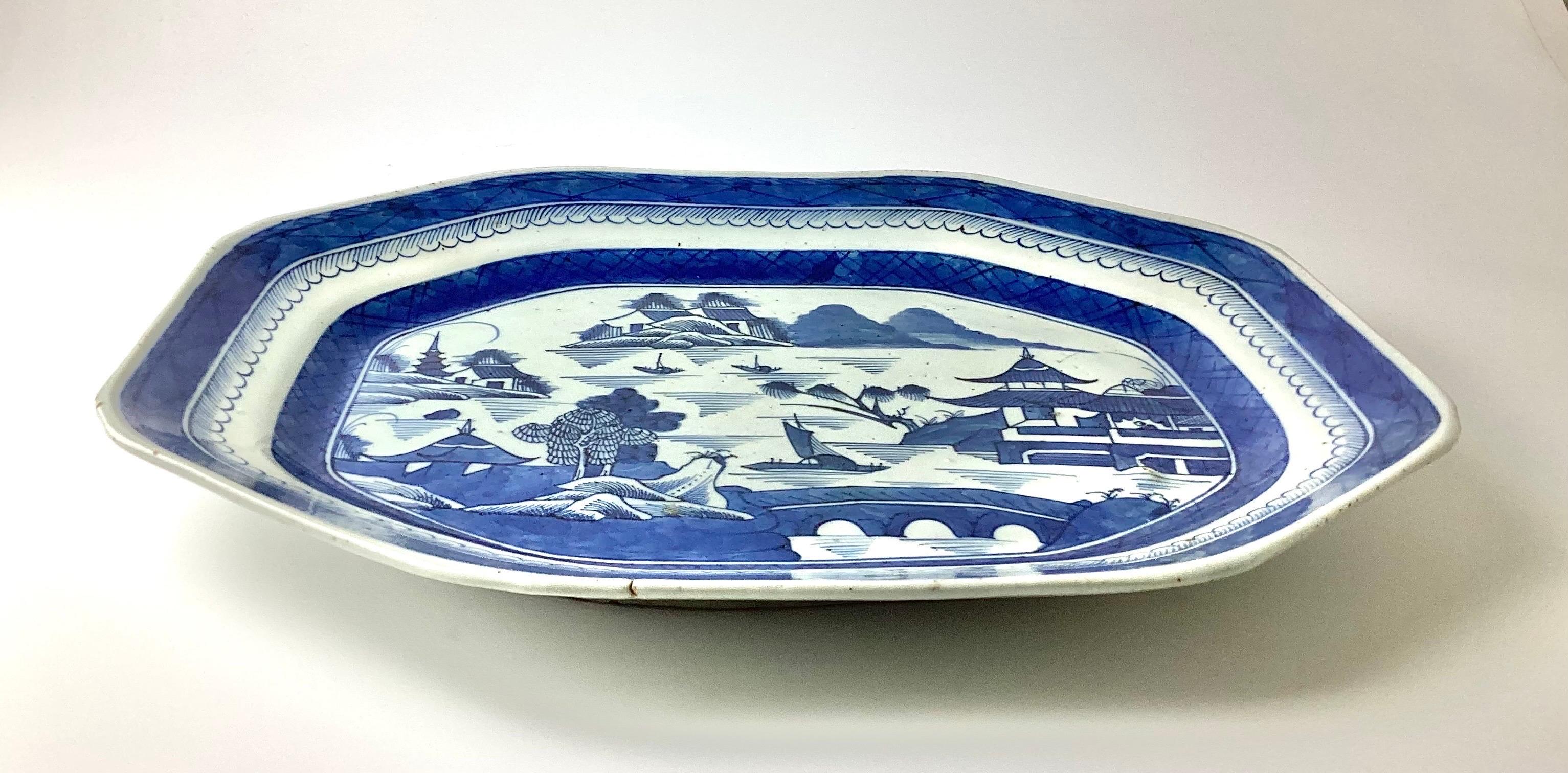 Antique Chinese canton porcelain blue export serving platter. Very good condition with some marks in the porcelain and glaze. Please note images, small fire mark on rim and bubble under the clay. Some writing on the back in pencil I can not read.