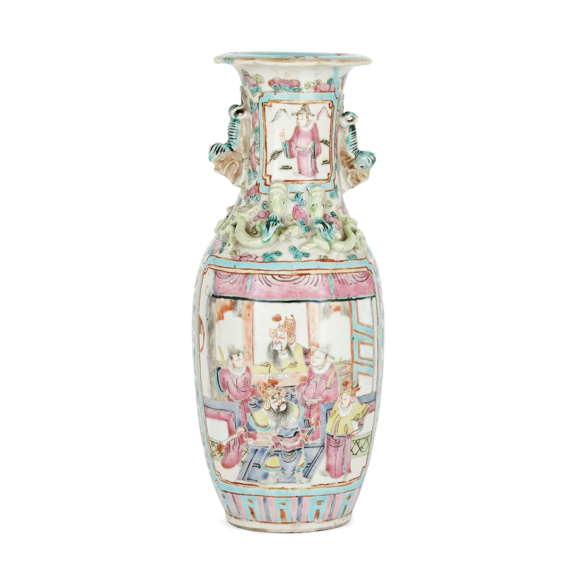 Antique Chinese Canton porcelain vase
Chinese, early 20th century
Measures: Height 24cm, diameter 10cm

This Canton porcelain vase has a fluted neck and is profusely decorated with hand-painted designs. On one side, a courtly interior scene sits