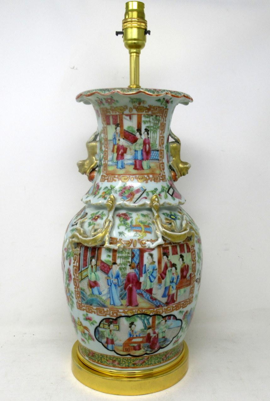 An exceptionally fine example of a Cantonese Hand Decorated Chinese Export Porcelain Vase of seldom seen large proportions no converted to an Electric Table Lamp, with its later heavy gauge circular ormolu base, mid Nineteenth Century. 

The main