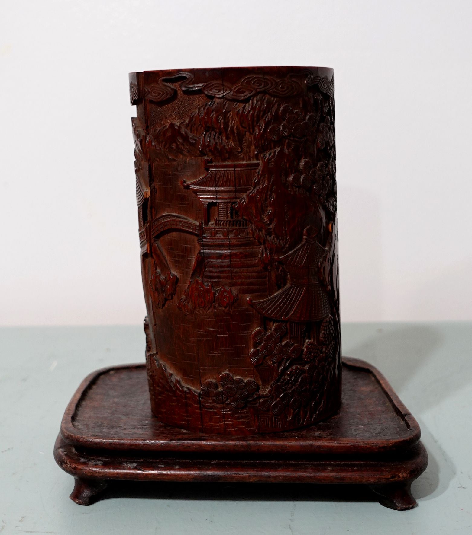 Antique Chinese Carved Bamboo Brush Pot from 18th to the early 19th Century with wood stand.
An amazing sophisticated design and carving details.