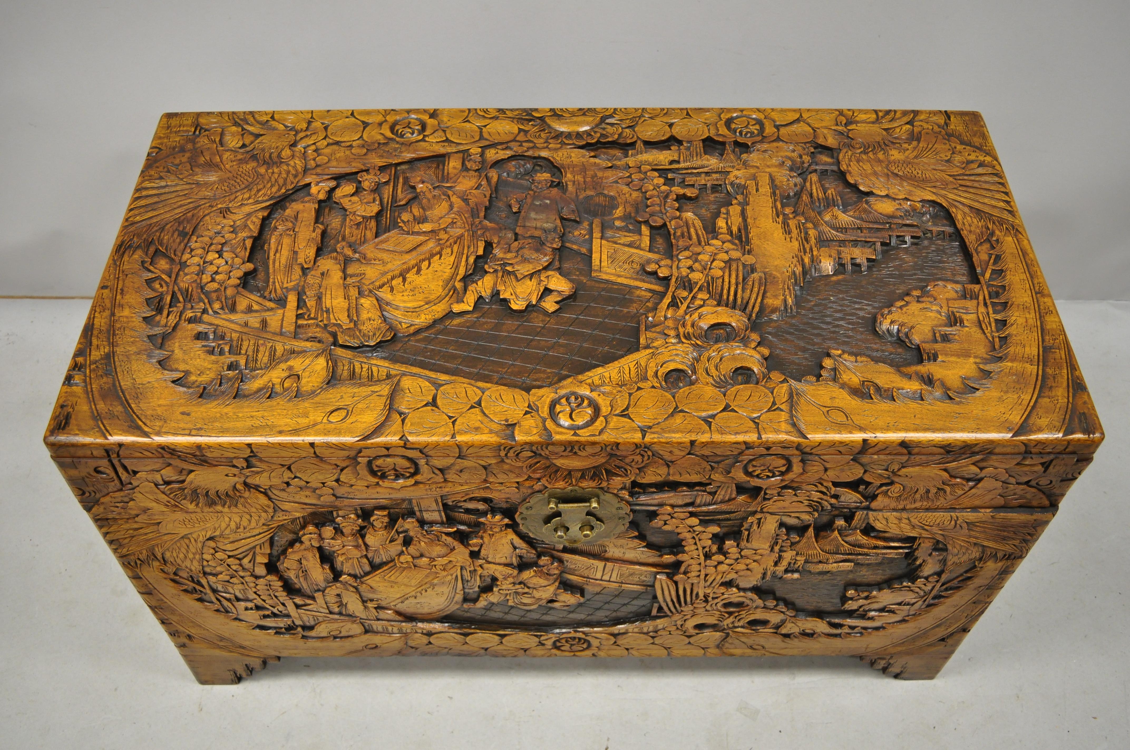 Antique Chinese carved camphor wood figural trunk blanket hope chest. Item features remarkable relief carved scenes with birds, wisemen, and palace scenes, solid wood construction, very nice vintage item, quality craftsmanship, circa mid-20th