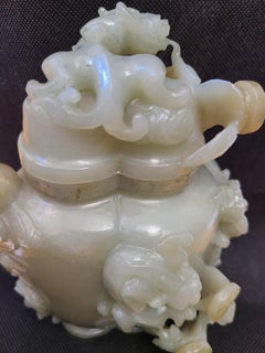 Antique Chinese Carved Celadon Jade Vase with Dragons on Wood Stand