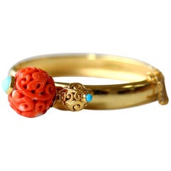 Antique Chinese Carved Coral Bead on a Gold Bangle