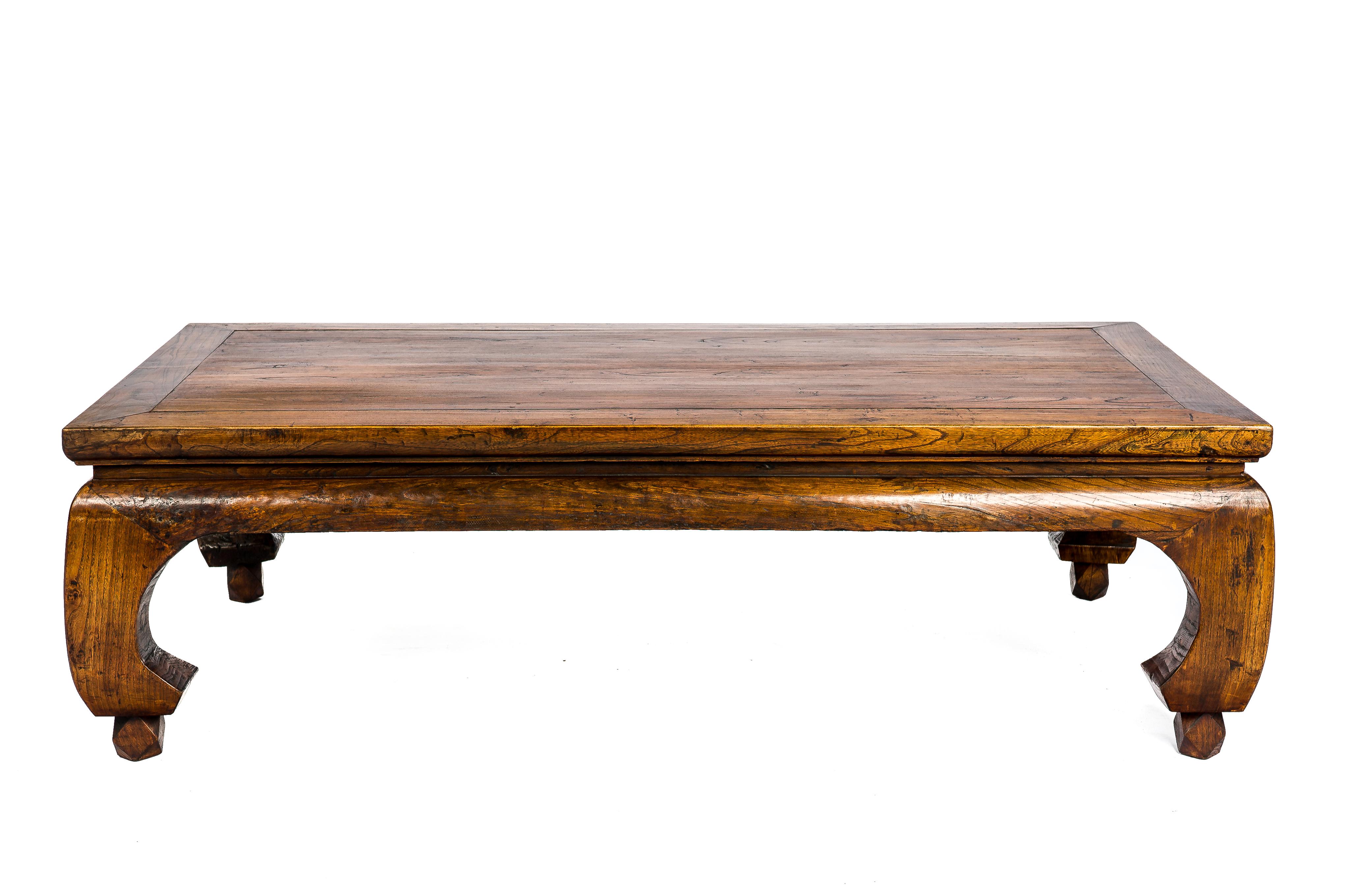 A Chinese Kang bed that was completely made in Ju Mu or elmwood.
The wood shows a beautiful dark grain and it has a rich and warm honey color with great patina and gloss. A Kang bed is primarily served as a bed placed in the living quarters were