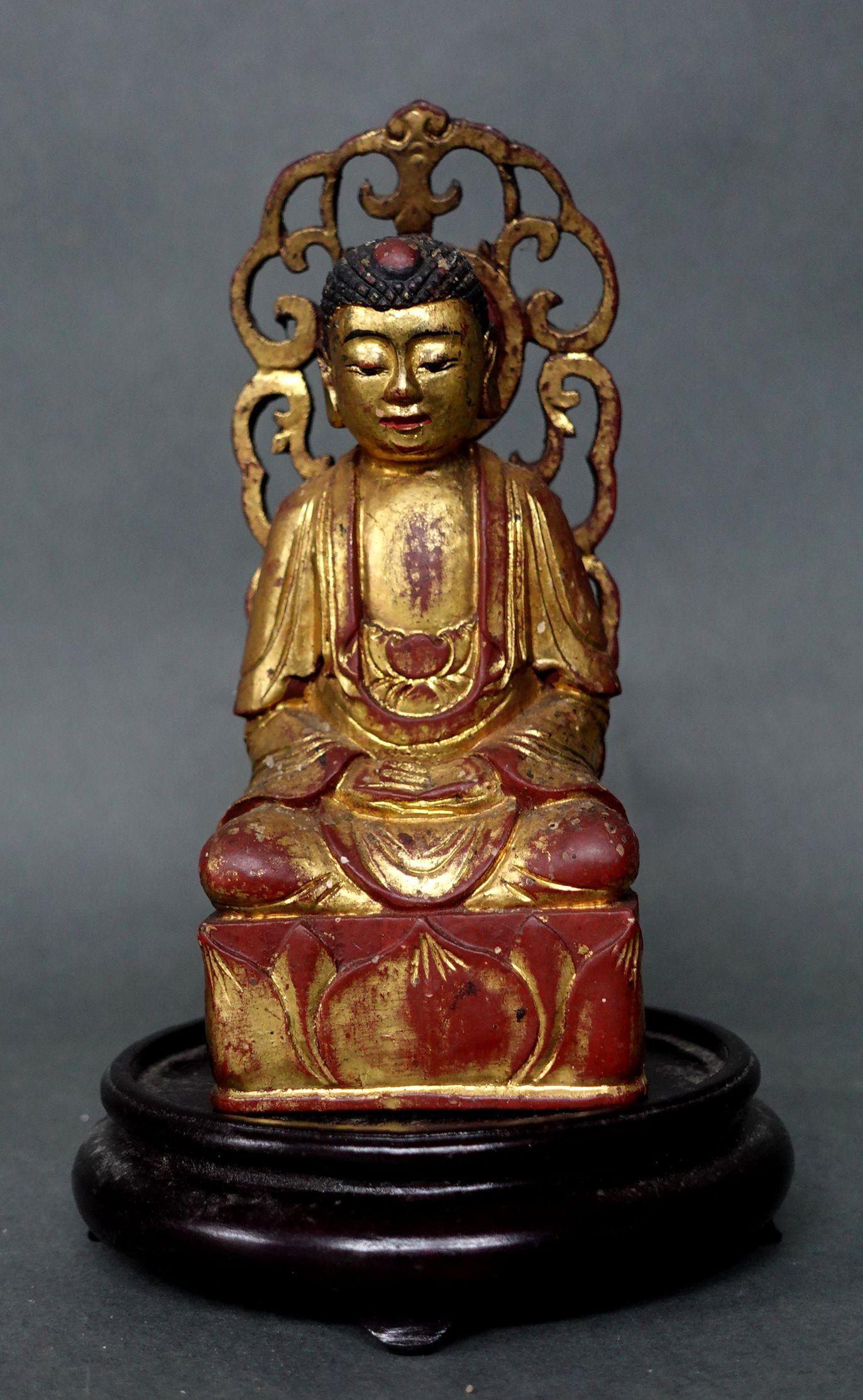 Antique Chinese carved gilt and polychrome wood sculpture of Seated Buddha.