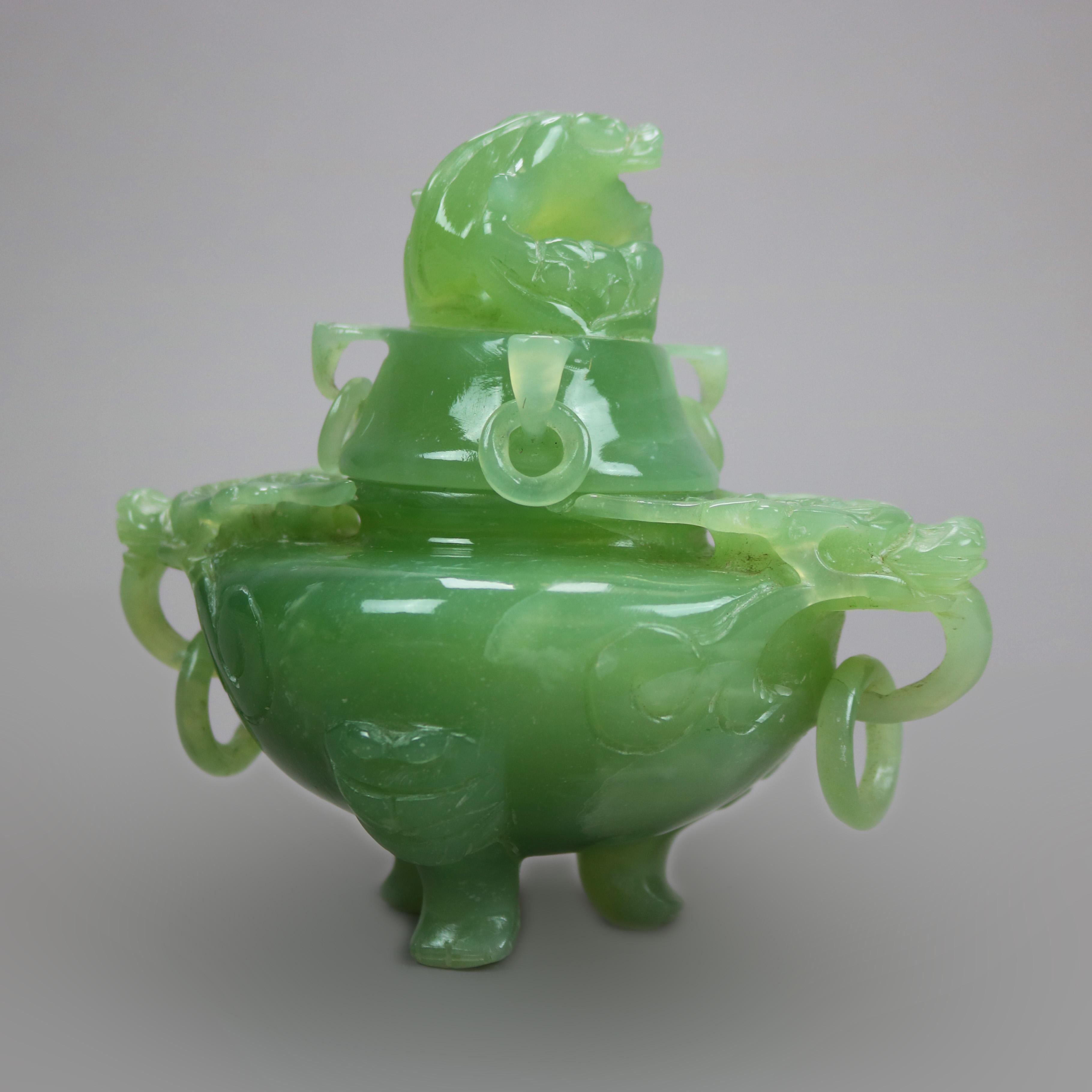An antique Chinese censor offers carved green jade construction with lid having dragon finial and bowl with flanking dragon handles and raised on paw feet, c1920

Measures - 5.5''H x 6''W x 4''D.
