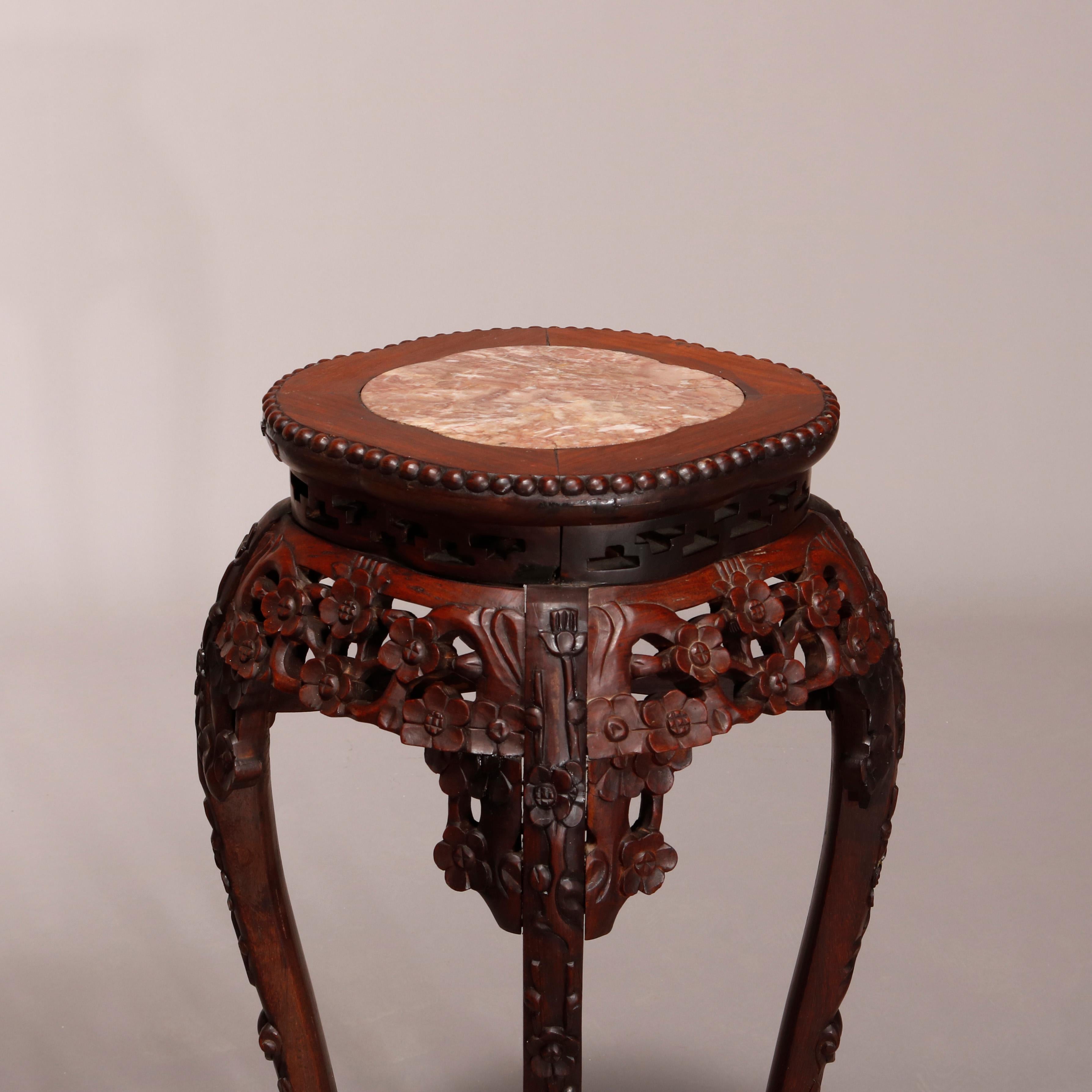 An antique Chinese fern stand offers inset marble display surmounting foliate and floral carved hardwood base having cabriole legs and raised cross stretcher, c1900.

Measures: 30.75