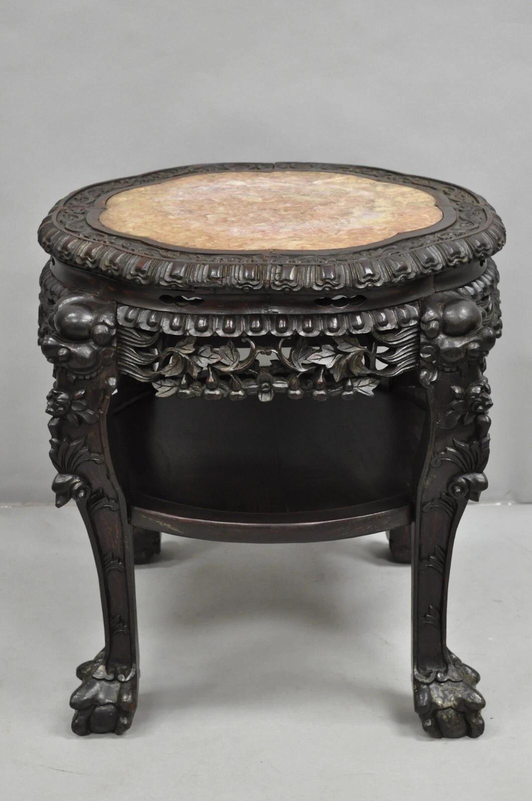 Antique Chinese Carved Hardwood Marble Top Pedestal Plant Stand Low Side Table with Foo Dog Carvings. Circa Early 20th Century. Measurements: 23