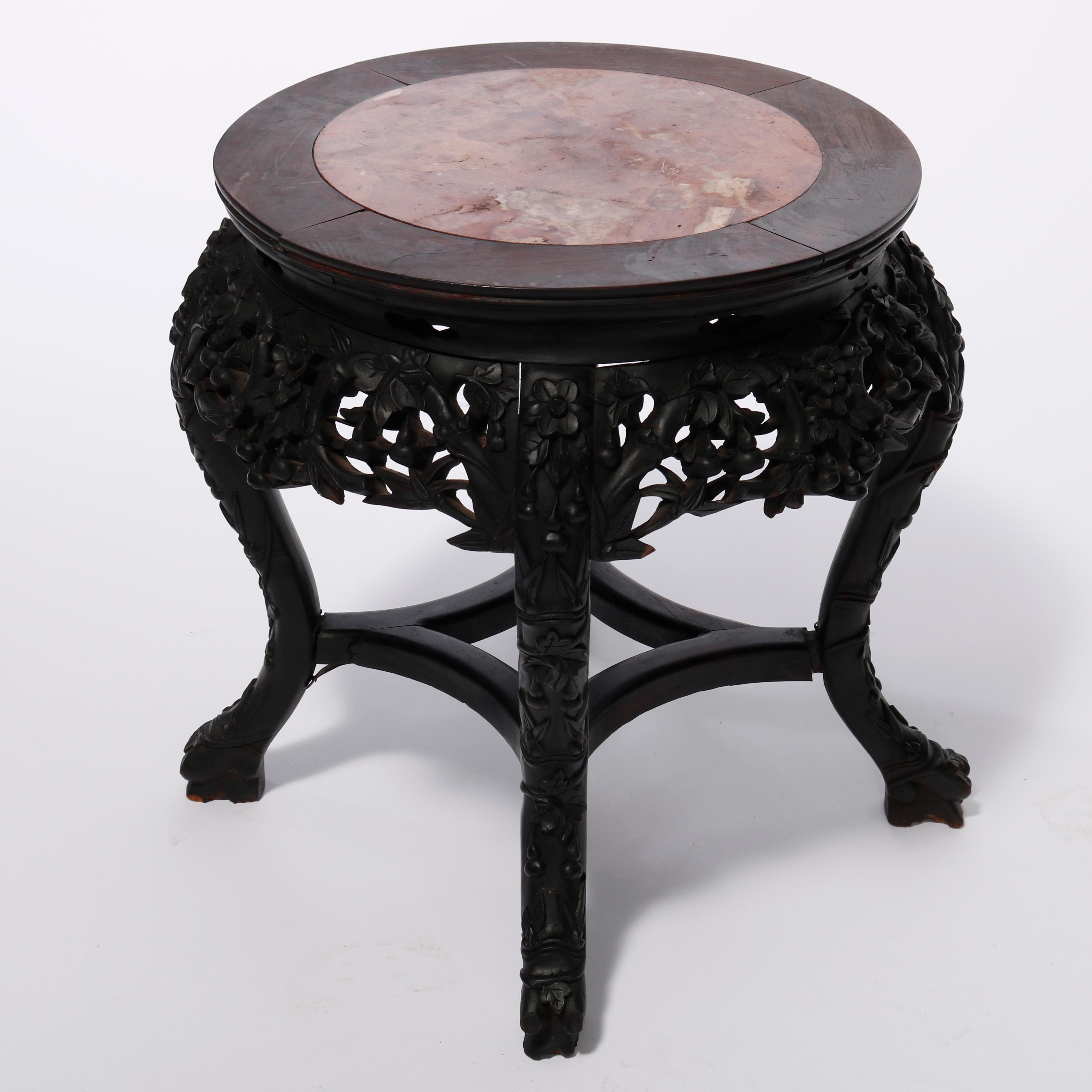 An antique Chinese plant stand offers inset marble top over hardwood base having pierced and carved foliate skirt, raised on cabriole legs terminating in carved stylized paw feet, c1920

Measures - 19'' H x 15'' W x 15'' D.

Catalogue Note: Ask