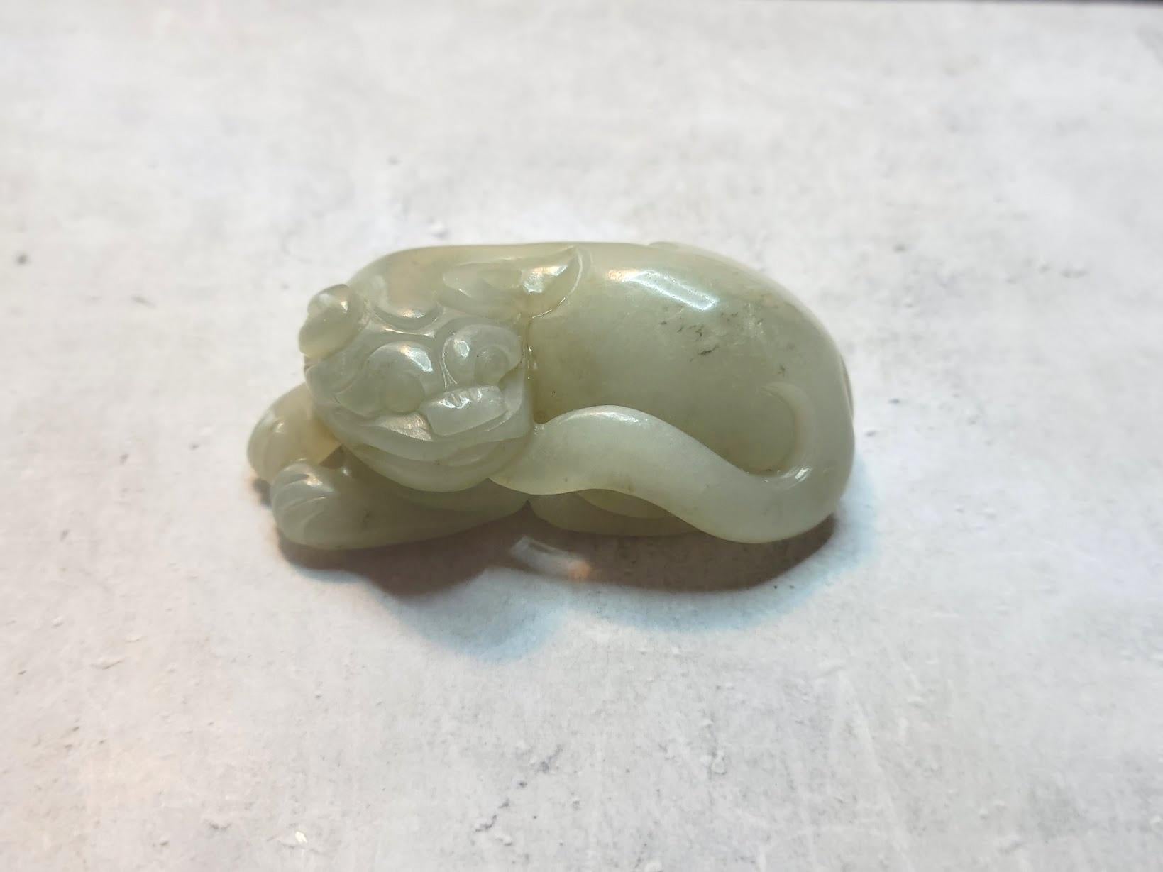 Antique Jade Carving of a Chinese Foo Dog – A Powerful Talisman of Protection & Prosperity

This exquisite jade carving depicts a majestic Foo Lion (Shi) in a gracefully coiled position—more than just a work of art, it is an ancient symbol of