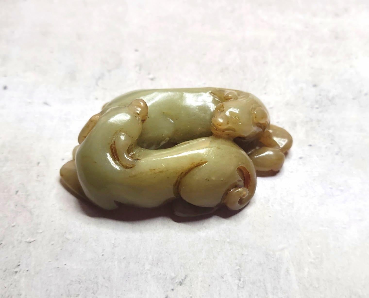A jade carving of two dogs in a circle holds deep cultural and symbolic significance in Chinese tradition.

In Chinese culture, dogs symbolize loyalty, protection, and good fortune.
Circular composition represents unity, eternity, balance, and