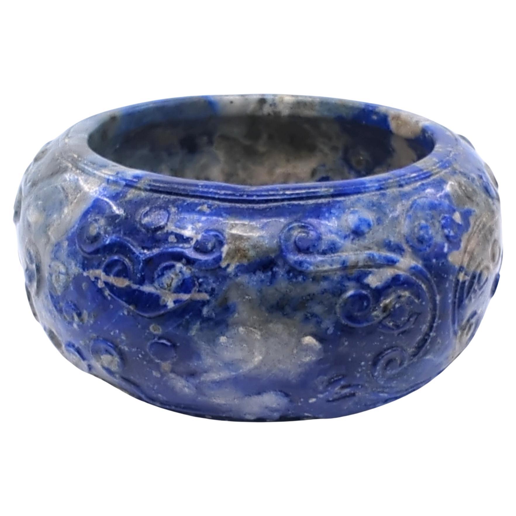 This antique hand-carved sodalite hardstone brush washer is a stunning example of traditional craftsmanship and artistic expression. The washer is of a compressed barrel form, a shape that is both elegant and functional, making it a suitable and