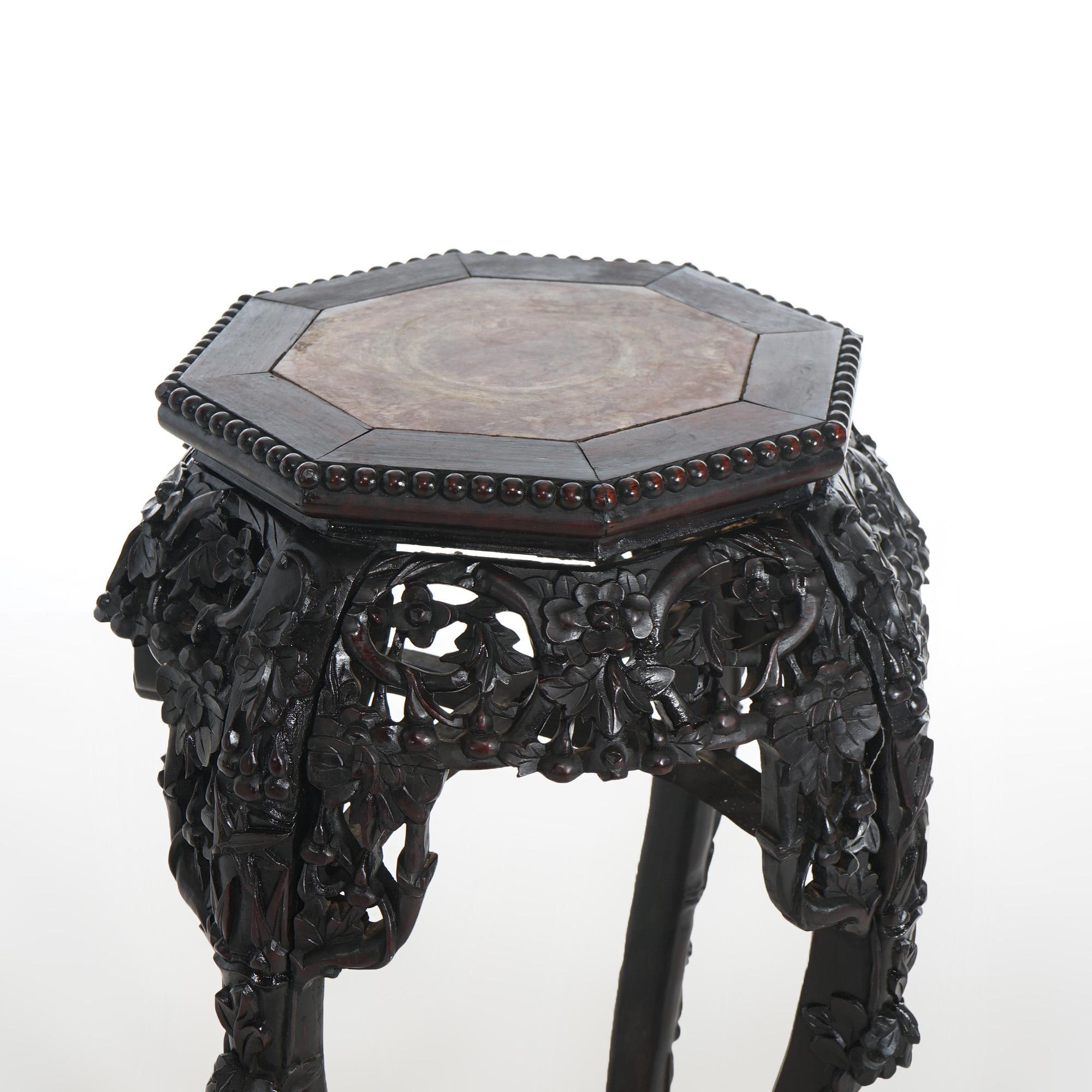 Antique Chinese plant stand with rouge marble top inset within rosewood base having carved foliate, bead and floral elements with stylized paw feet, c1900

Measures - 35.5