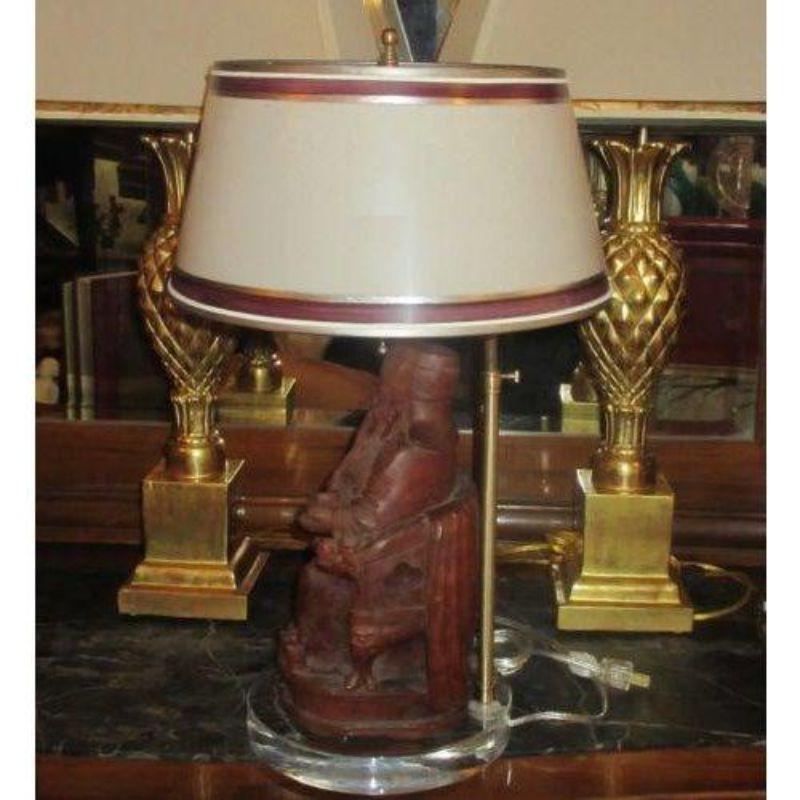 Antique Chinese carved wood Buddha sculpture lamp. Later electrified with Lucite base and custom made shade.

Additional information:
Materials: Lucite, Parchment, Wood
Color: Brown
Period: 19th Century
Place of Origin: China
Styles: