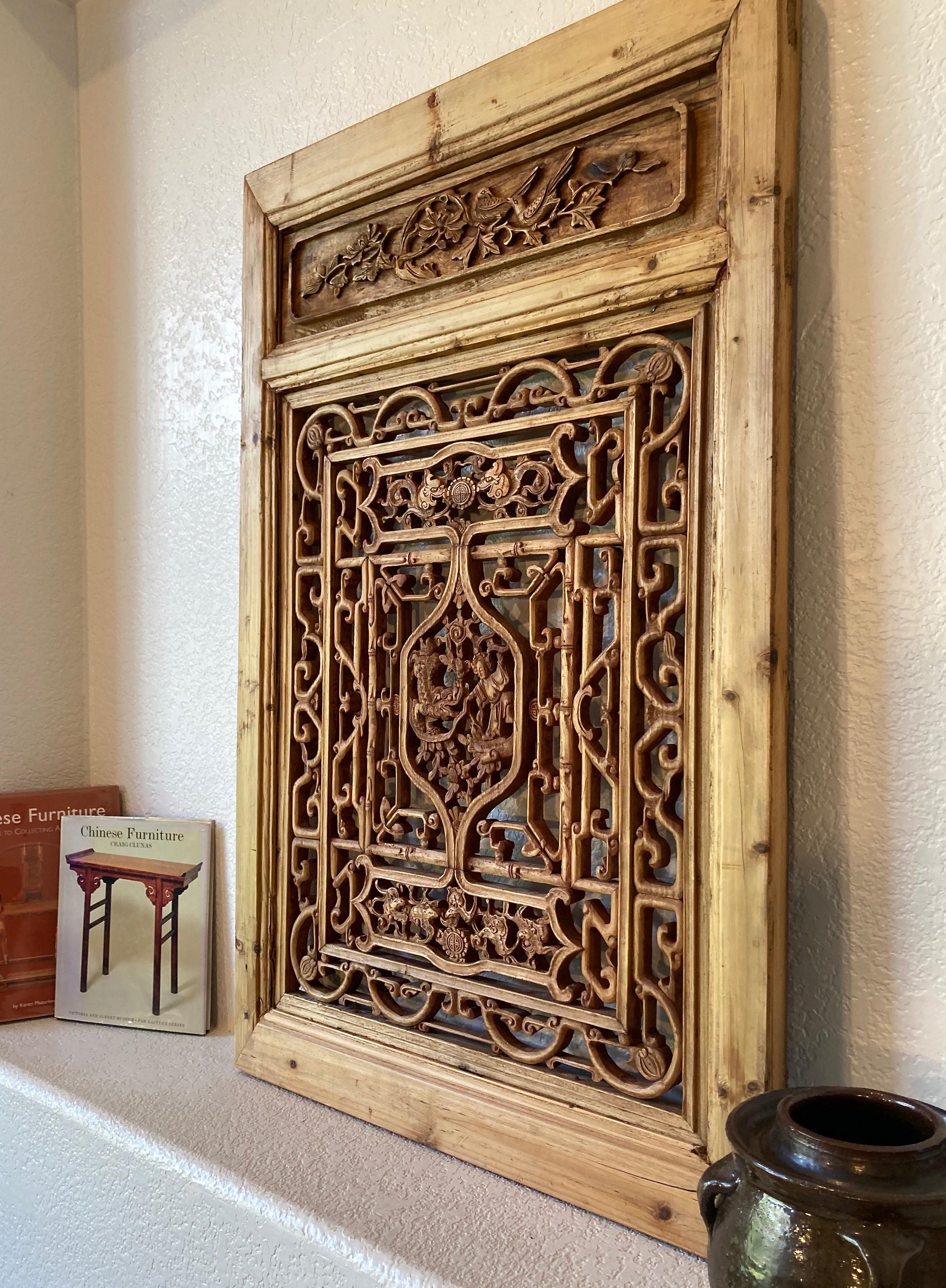 Framed panel, center carving with personage and dragon motifs. Surrounding floral, dragon, animal and bamboo motifs.