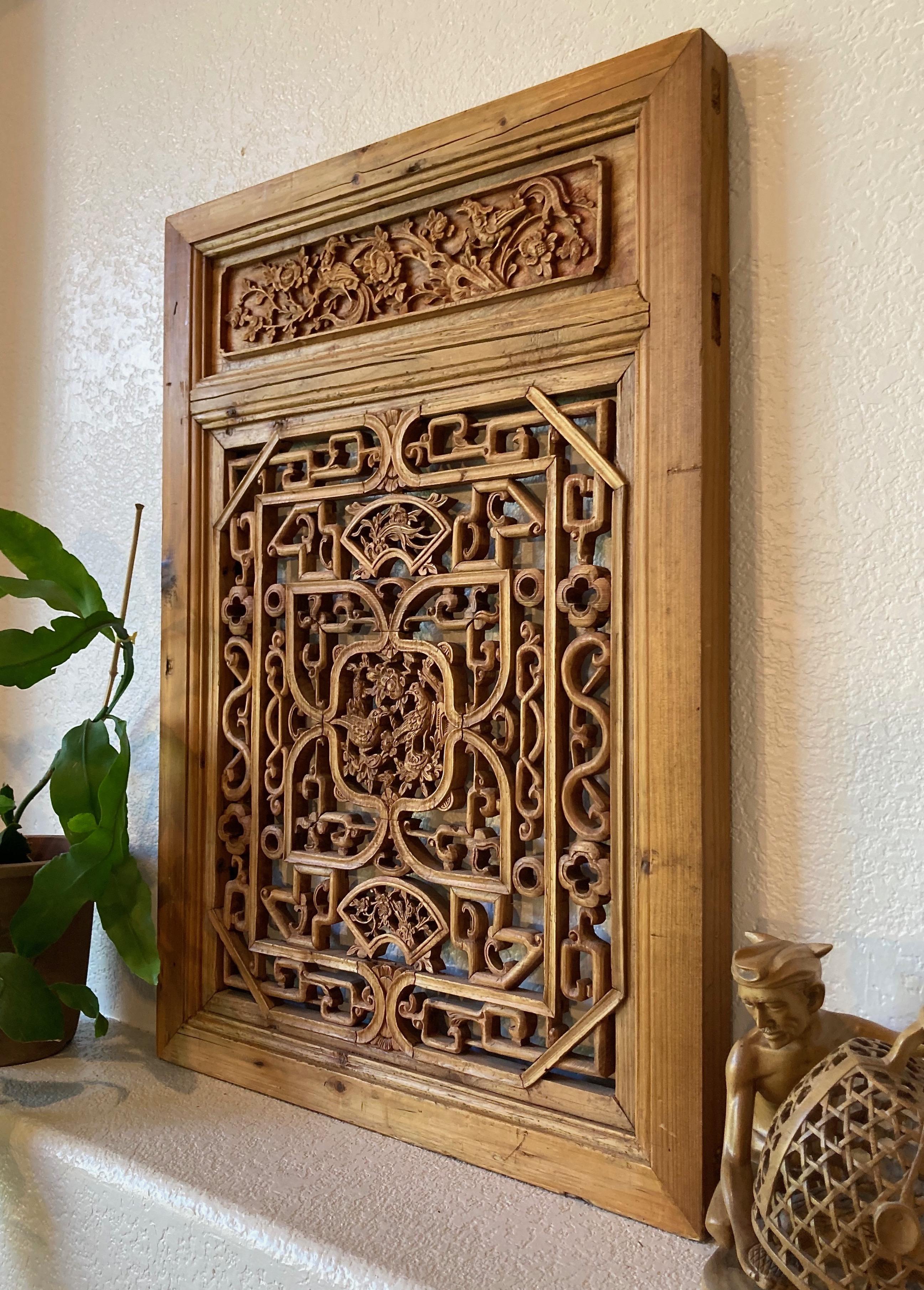 Framed panel, center carving with birds. Top and bottom panes with fan shaped carvings and floral motifs.