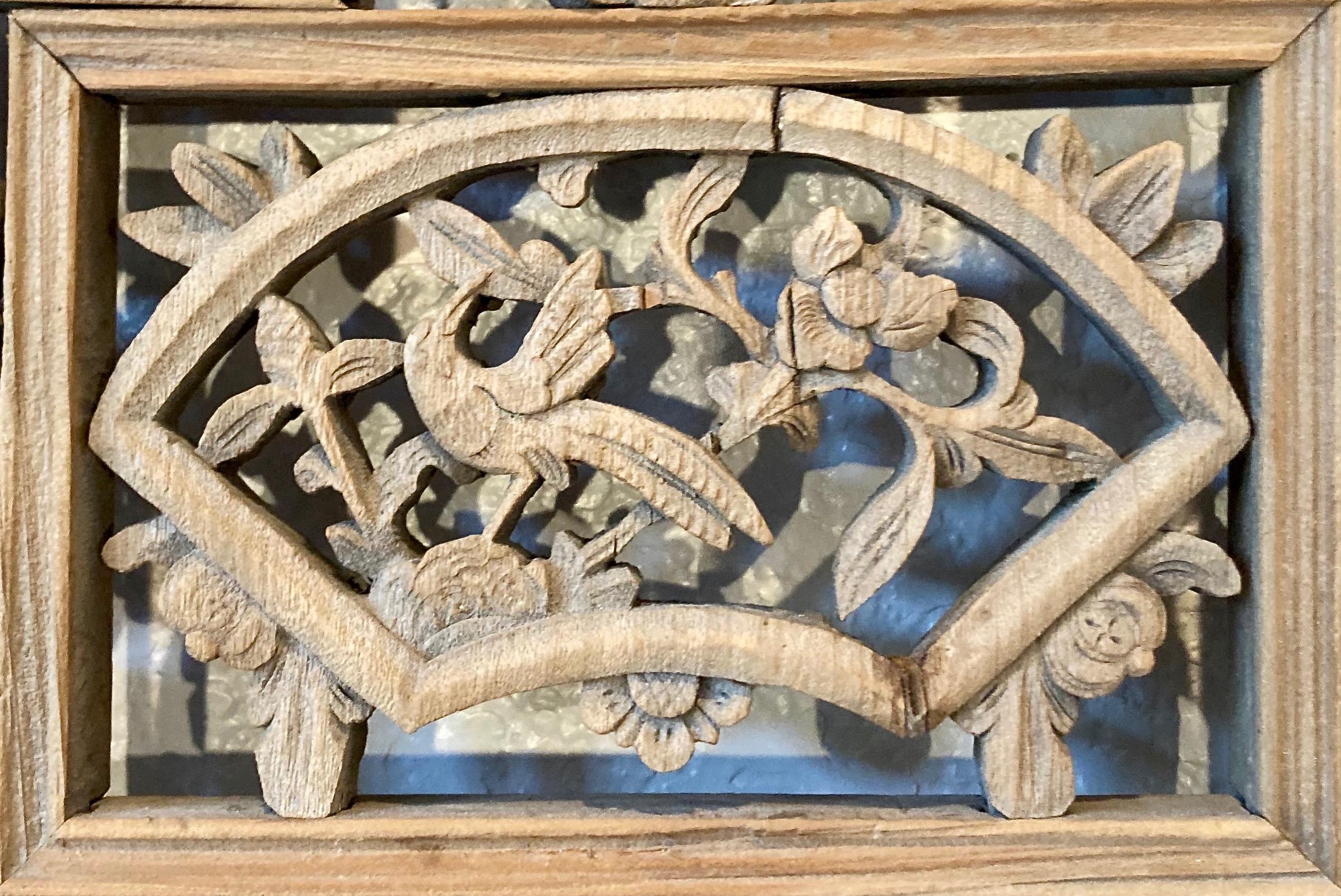 Thick framed panel with three panes, openwork and relief carvings, and lattice work. Fan shaped center carving with bird/floral motif. Lower pane likely depicts ancient Chinese agriculture.