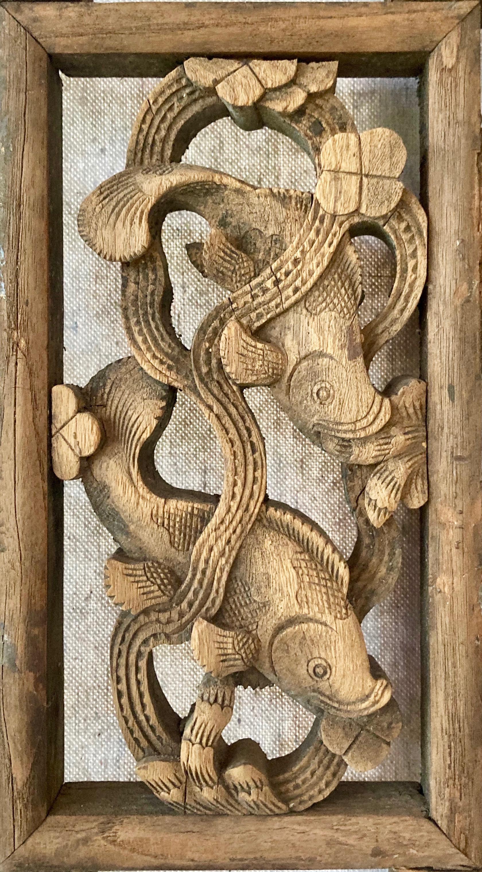 Heavy, thick framed three-pane panel includes openwork carving, relief carving + lattice work techniques. The rectangular center carving includes a pleasant fish motif. The lower pane features personage in a garden.