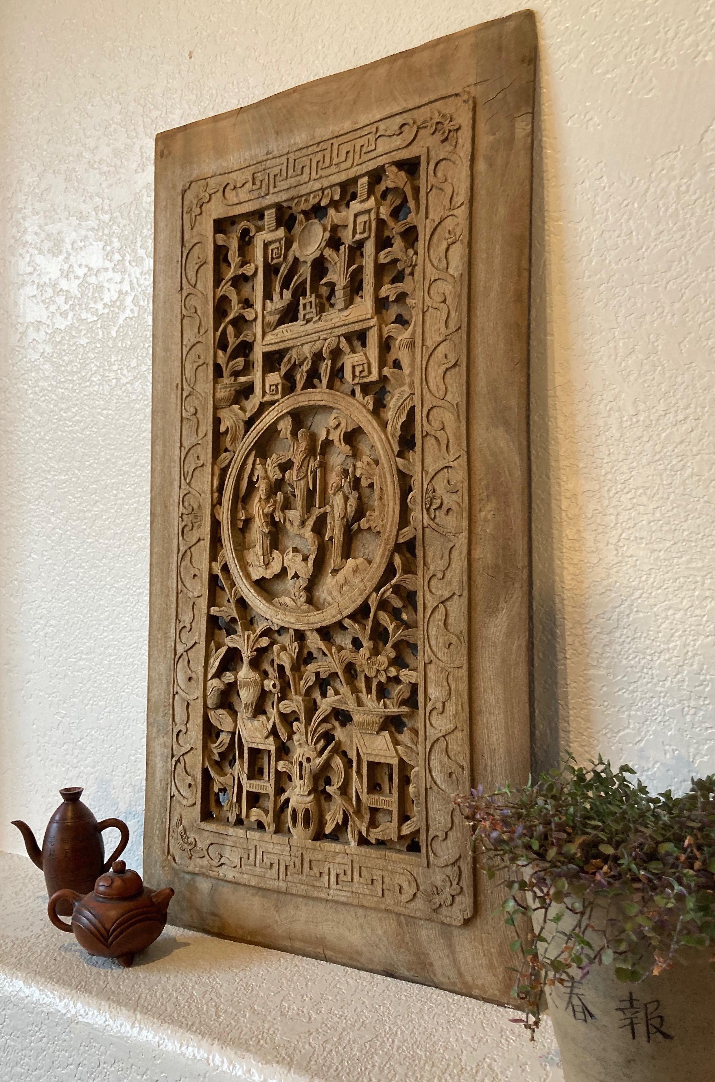 Unframed panel, hand carved from a solid piece of wood. Circular center carving with personage and floral motifs.