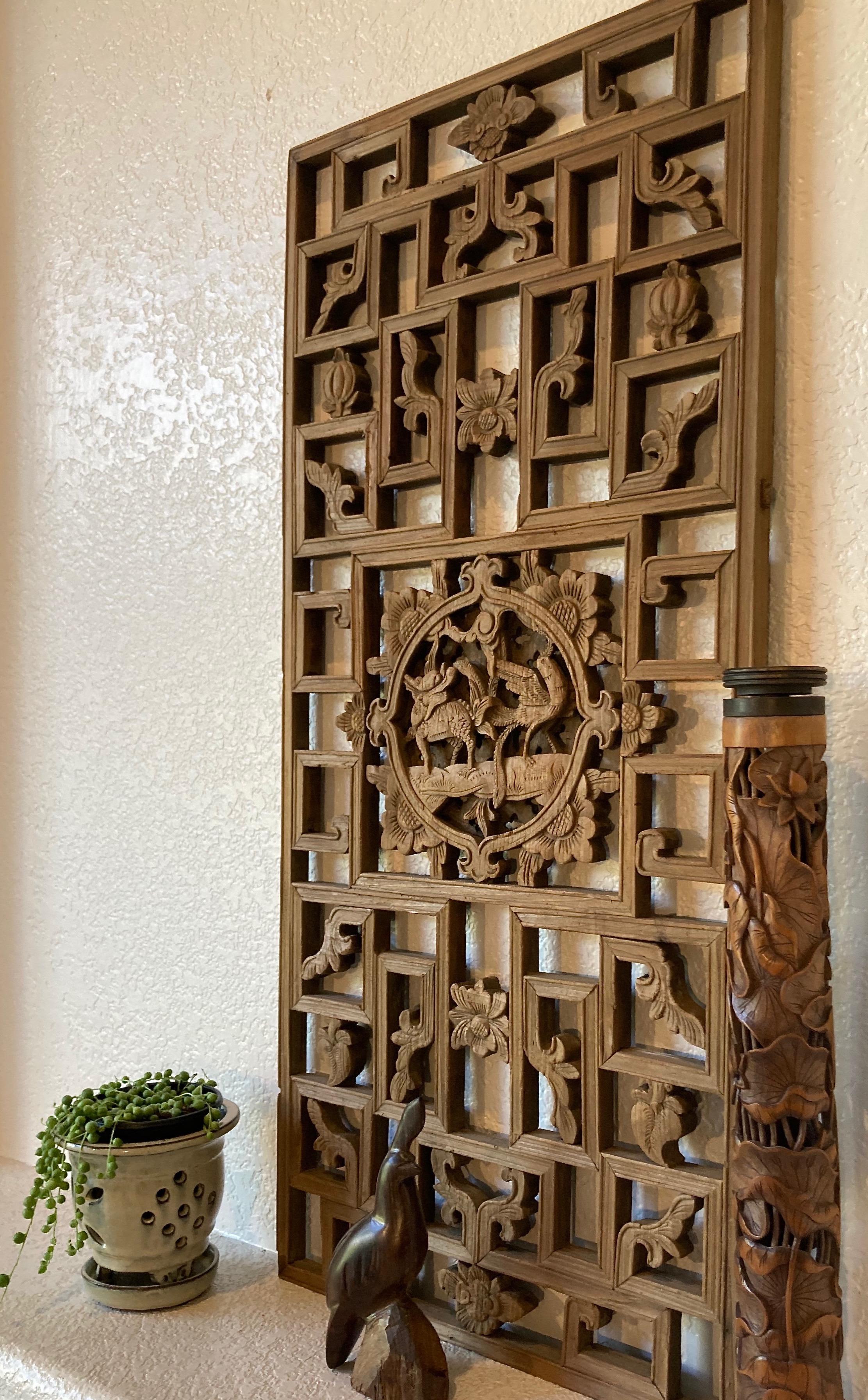 Lattice panel with square center carving with beast and bird motif. Surrounding floral motif.