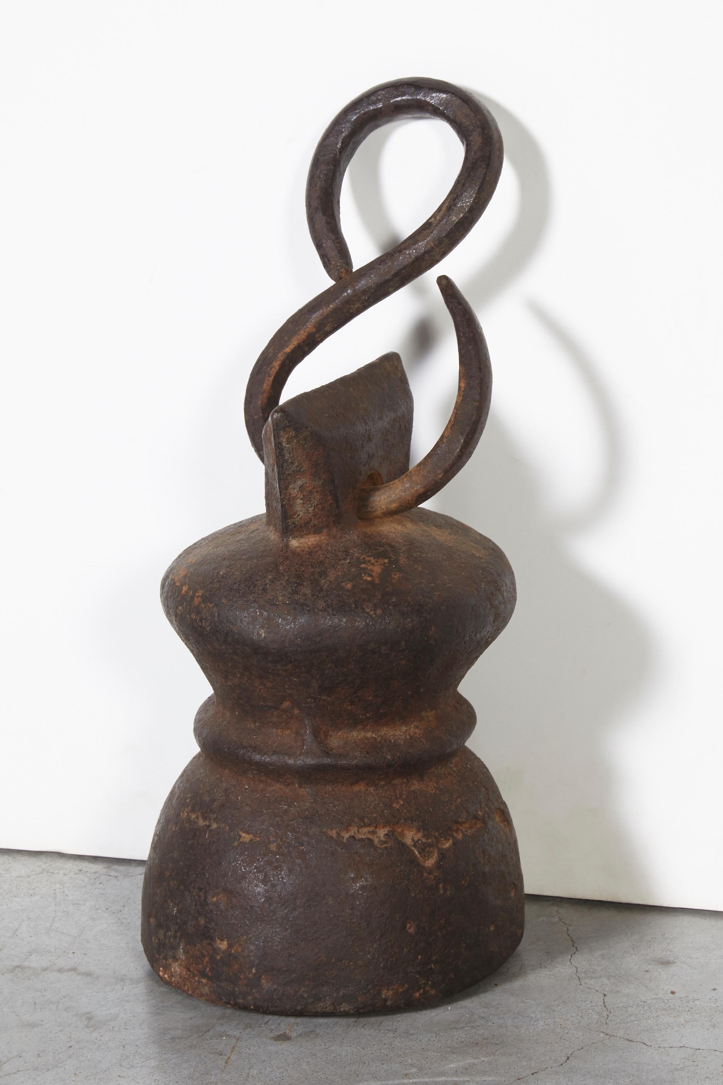 A tall, solid cast iron 19th century Chinese weight. Beautifully worn, with original hand forged hanger. A heavy piece with presence and history.
Measures: Height of piece: 8